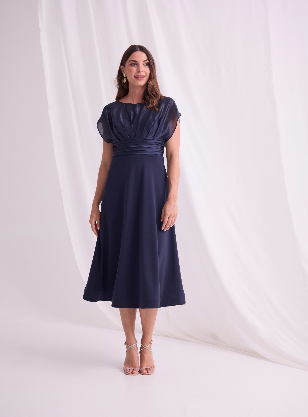Navy cap sleeve midi dress with pleated waist.