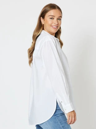 Side view white blouse with blue jeans women’s everyday outfit