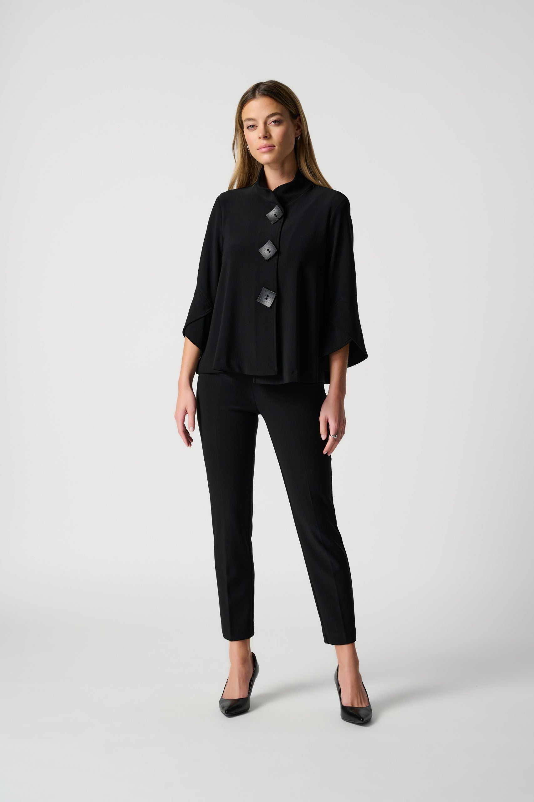Black pants with button detail top outfit