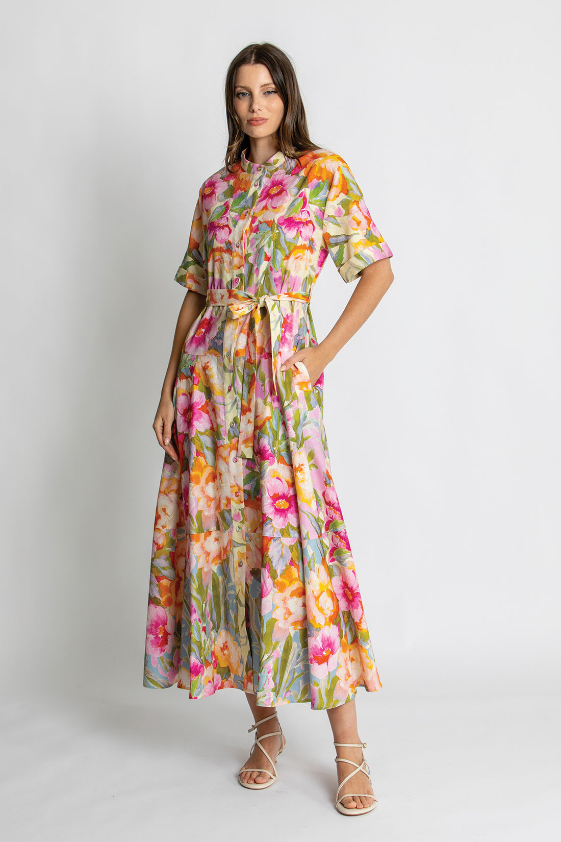Vibrant floral print belted midi dress with short sleeves.