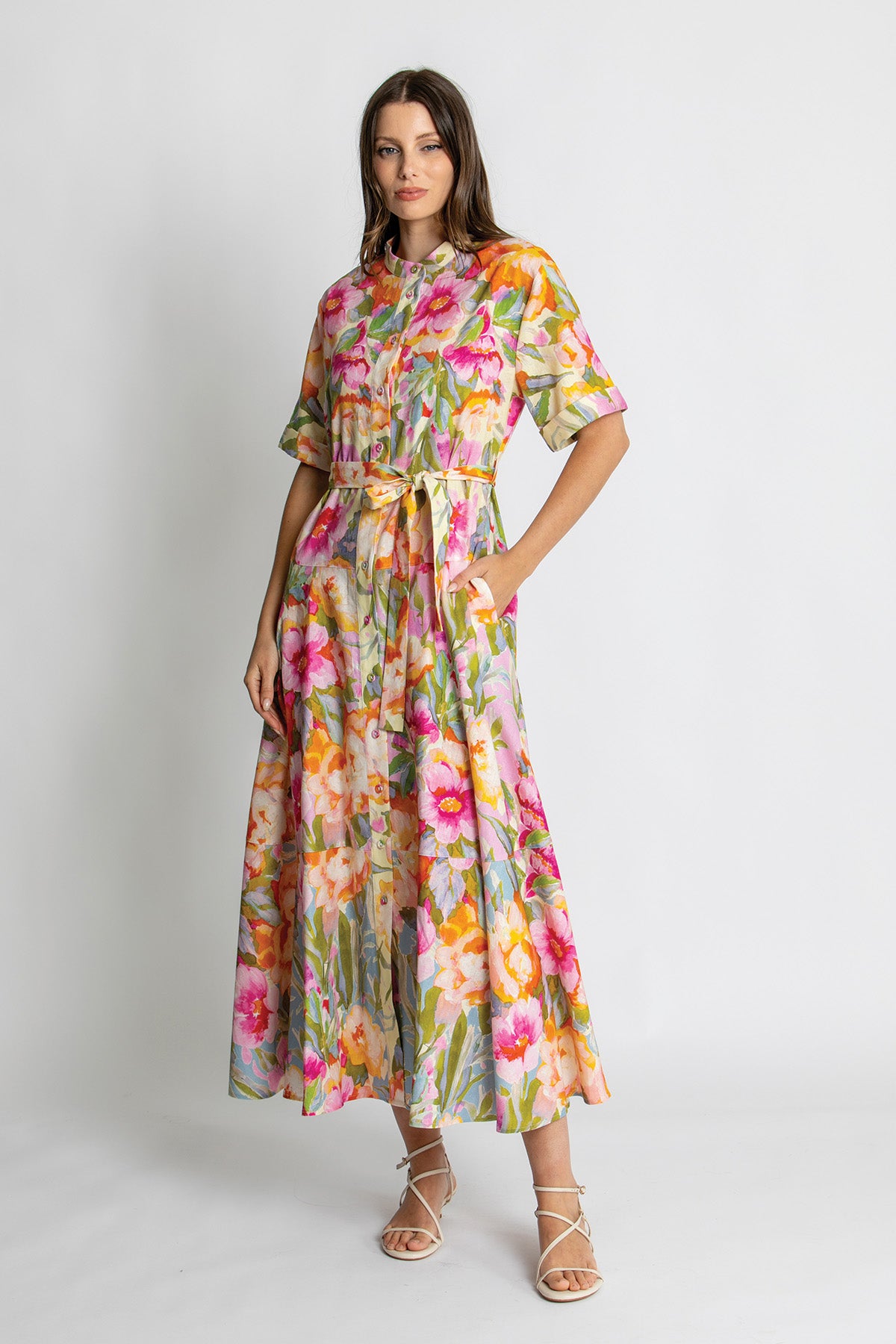 Vibrant floral print belted midi dress with short sleeves.