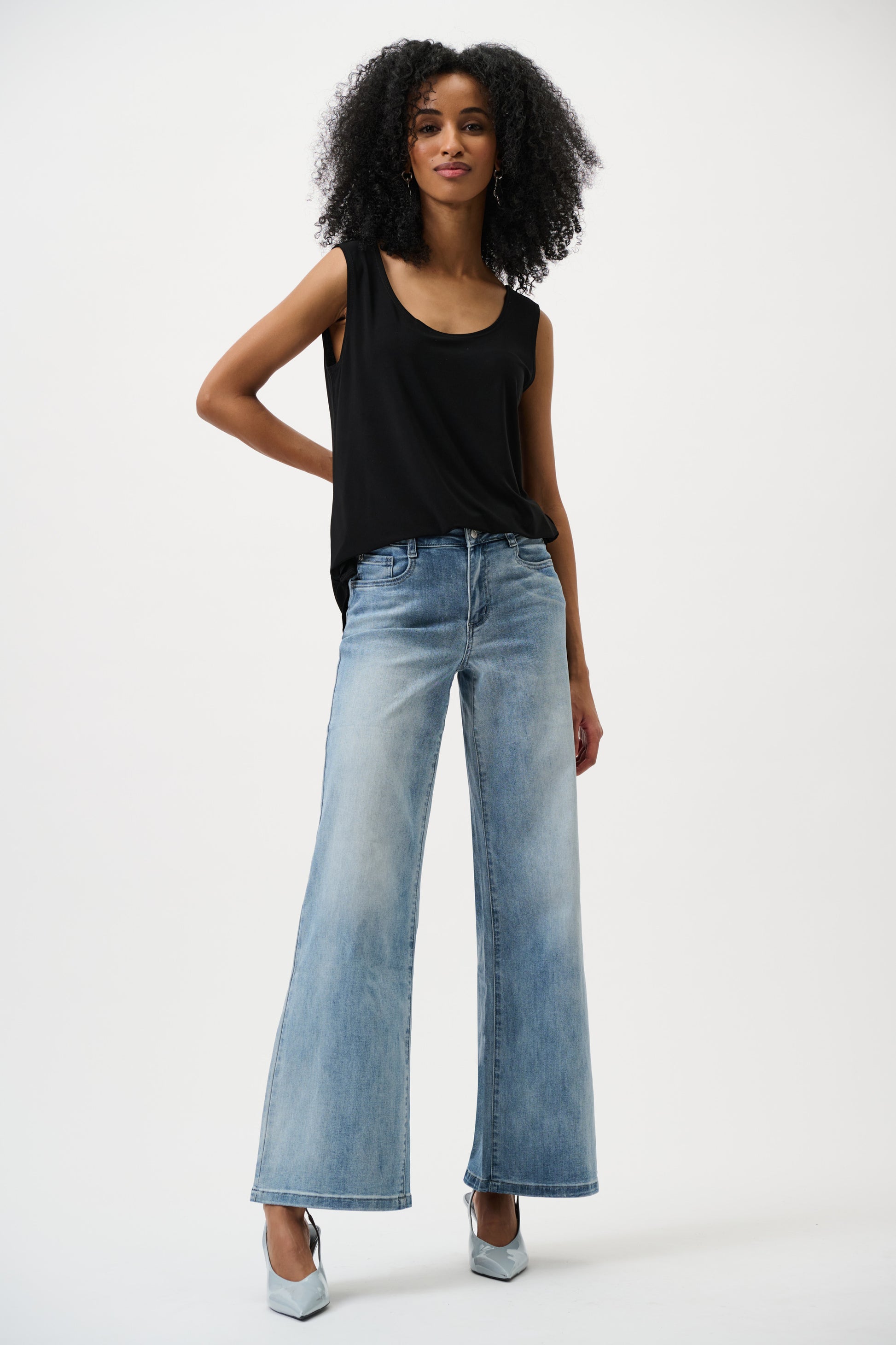 Women’s black sleeveless top with wide leg jeans modern casual full body look