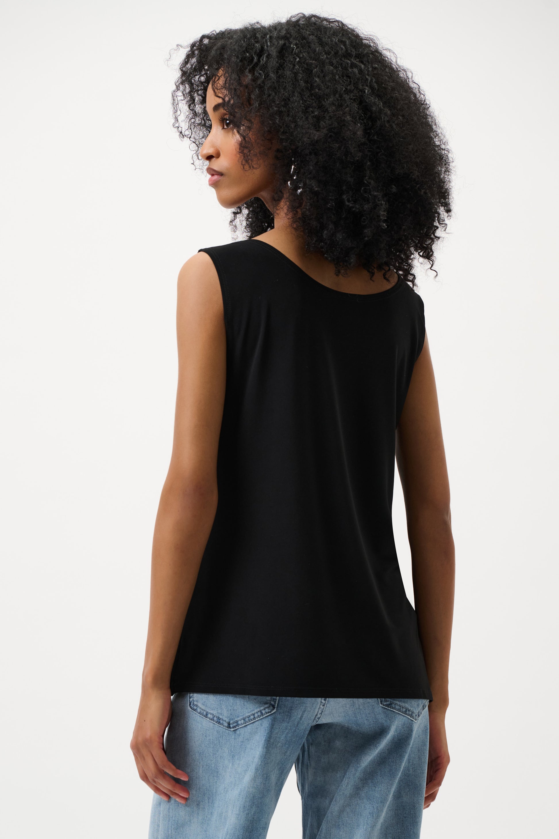 Women’s black sleeveless top back view relaxed fit with light wash denim jeans