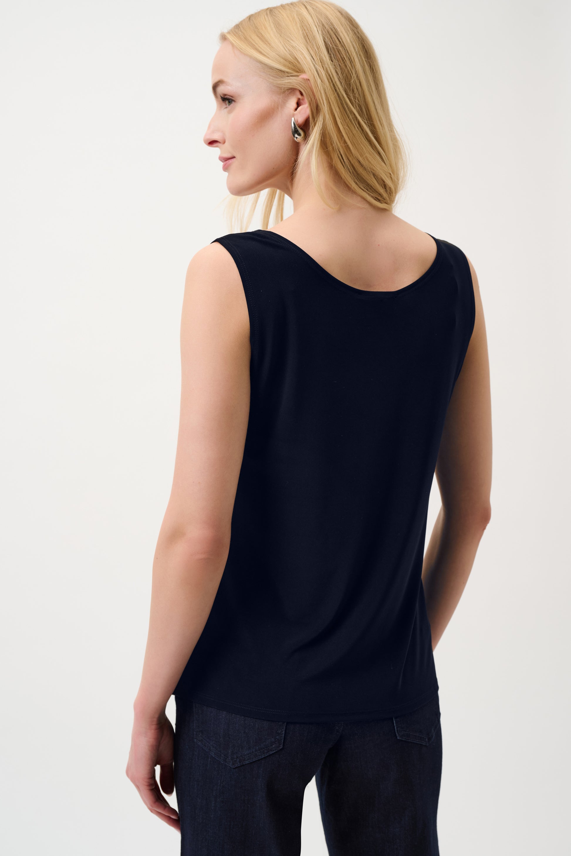 Women’s navy sleeveless top back detail soft drape fabric minimal everyday wear