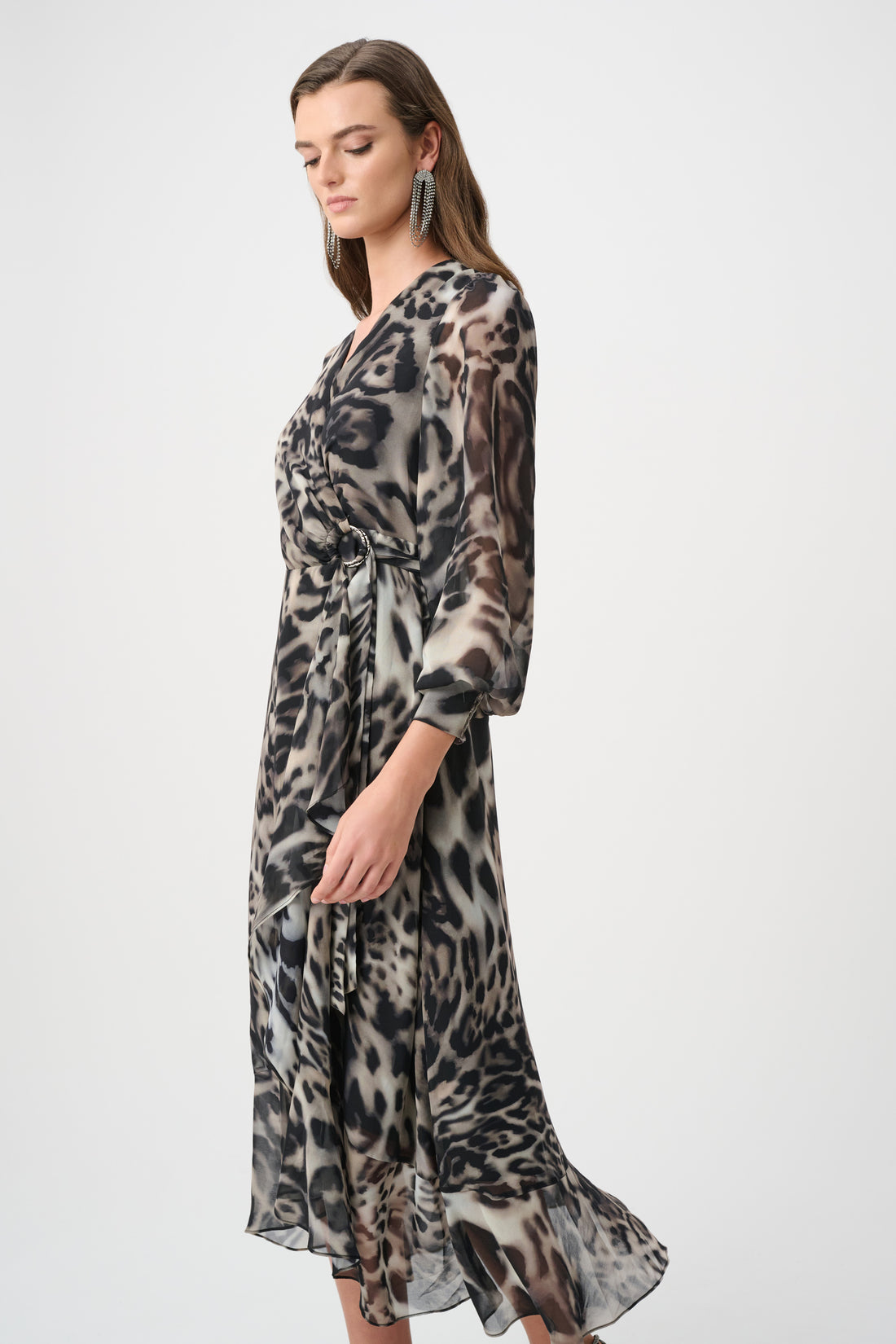 Woman wearing animal print chiffon wrap midi dress