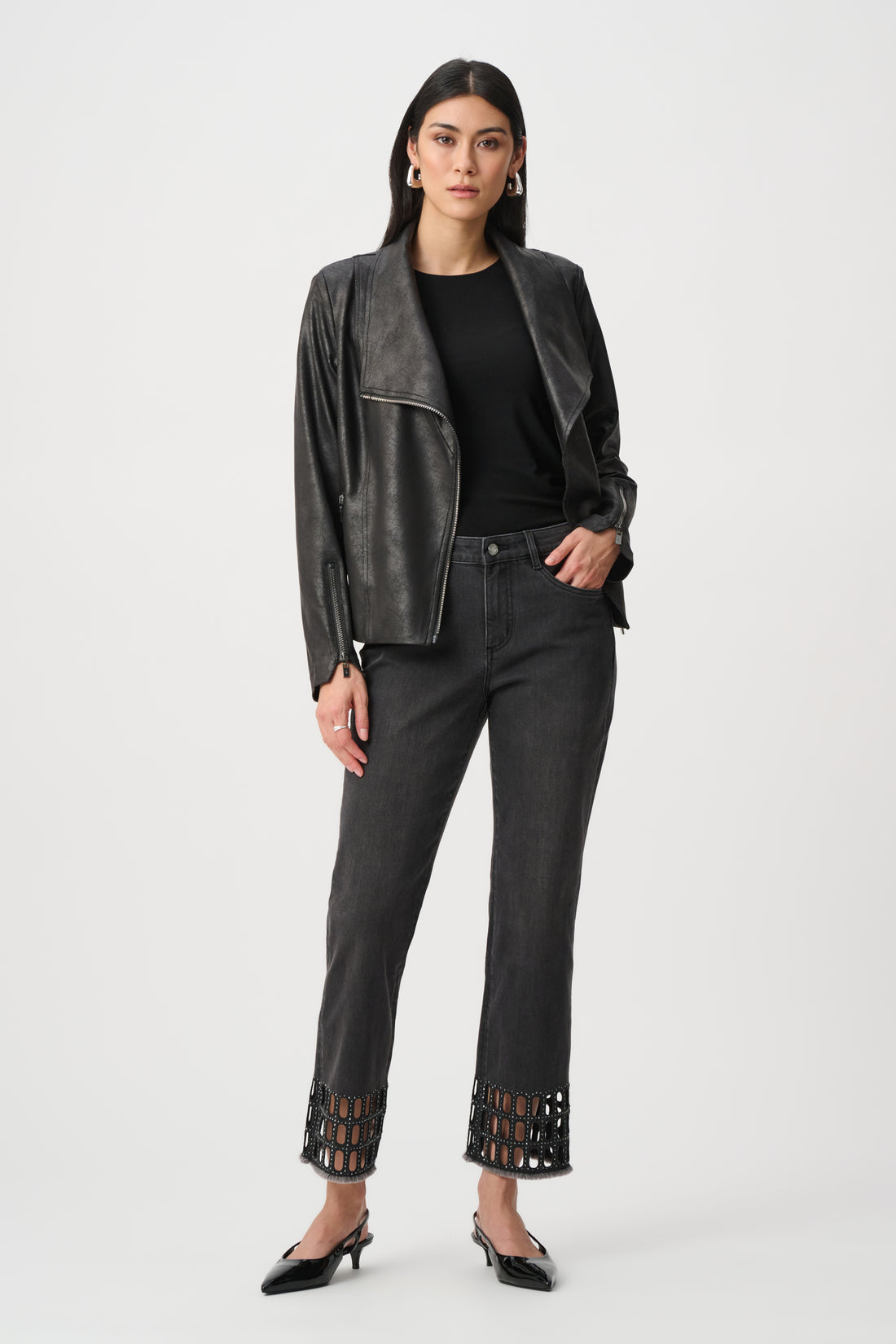 Black straight jeans with cut-out hem worn with leather jacket