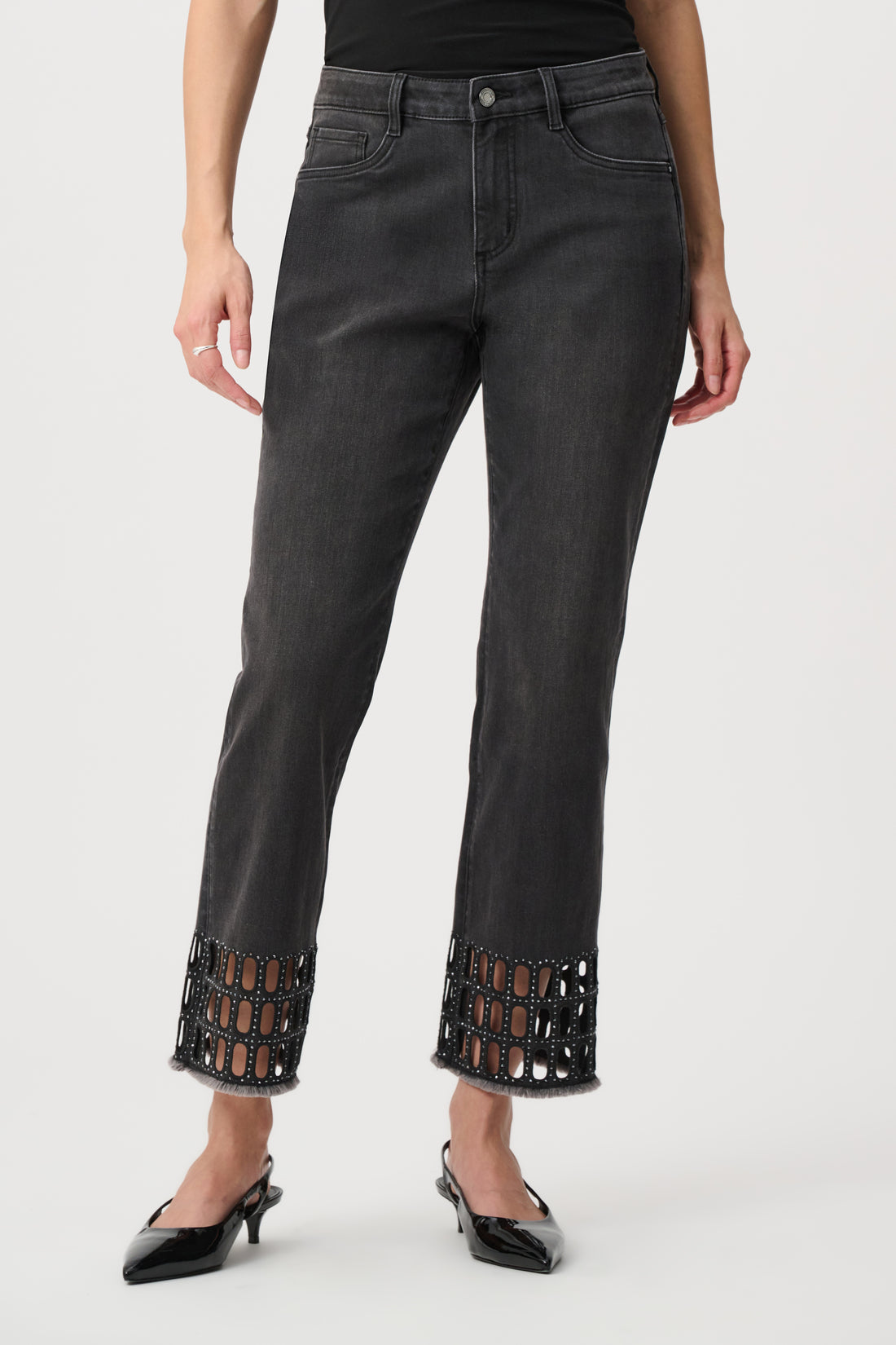 Black straight jeans with cut-out hem worn with leather jacket