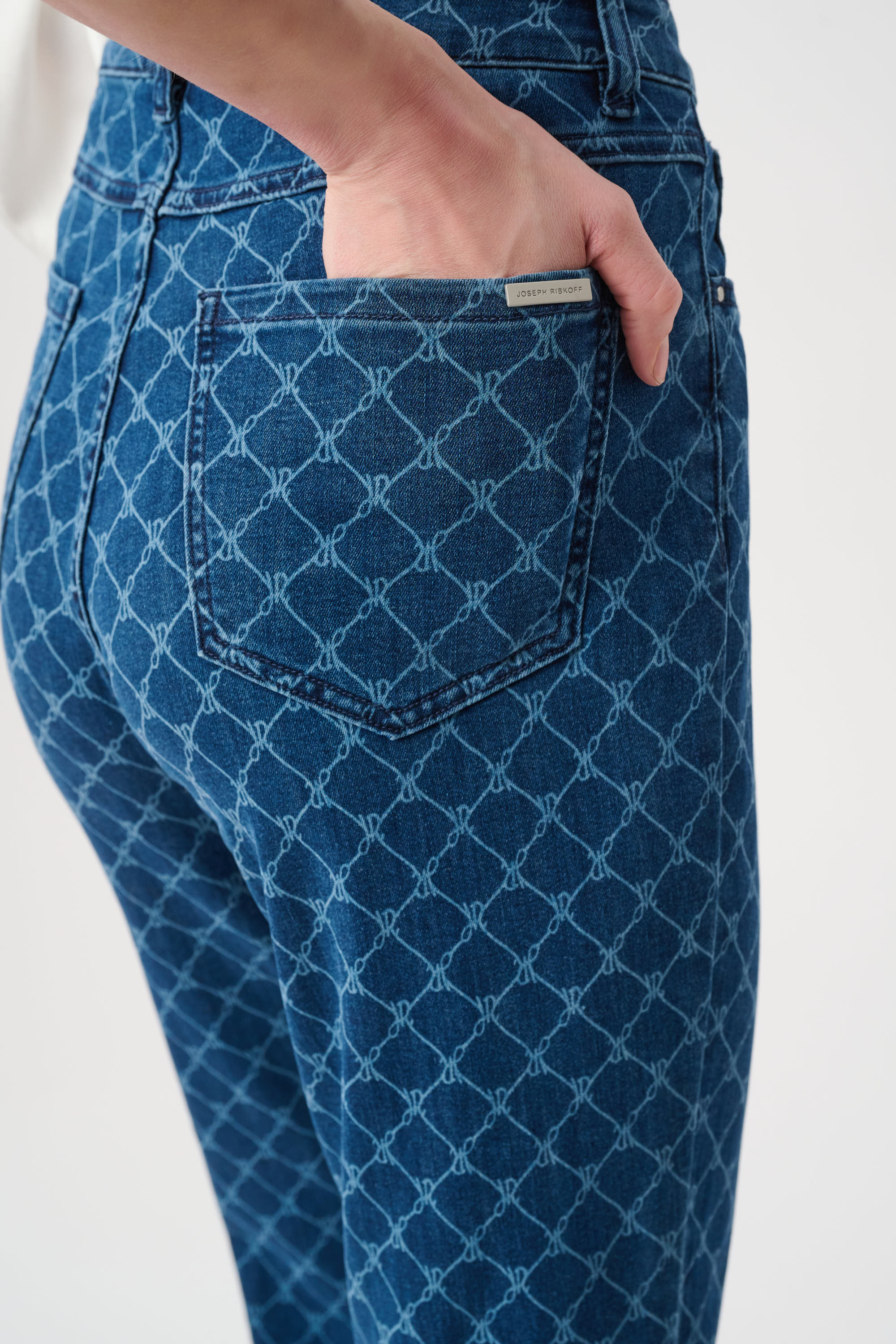 Close-up of blue geometric print jeans pocket detail and fabric texture