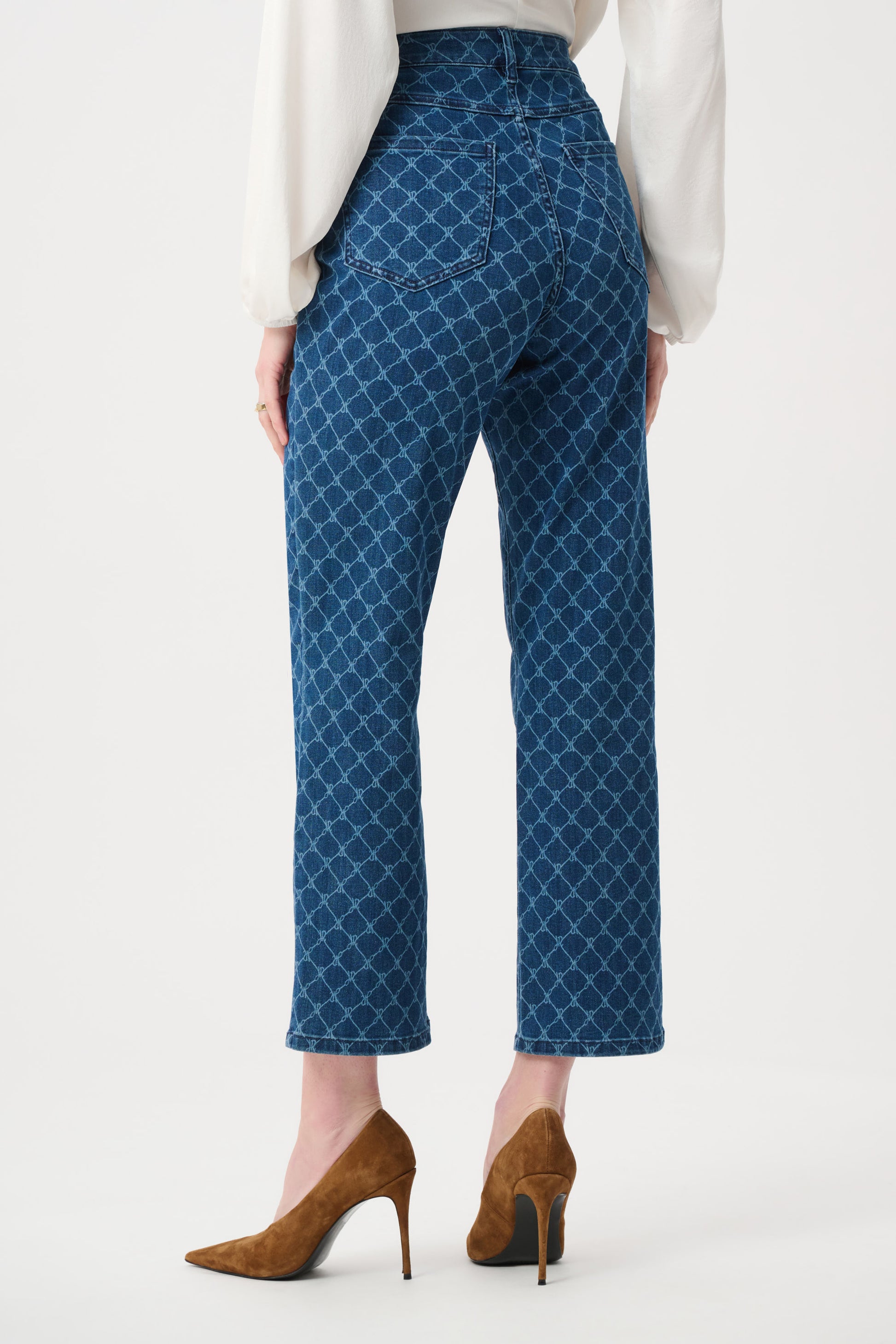 Back view of women’s blue patterned straight leg denim jeans