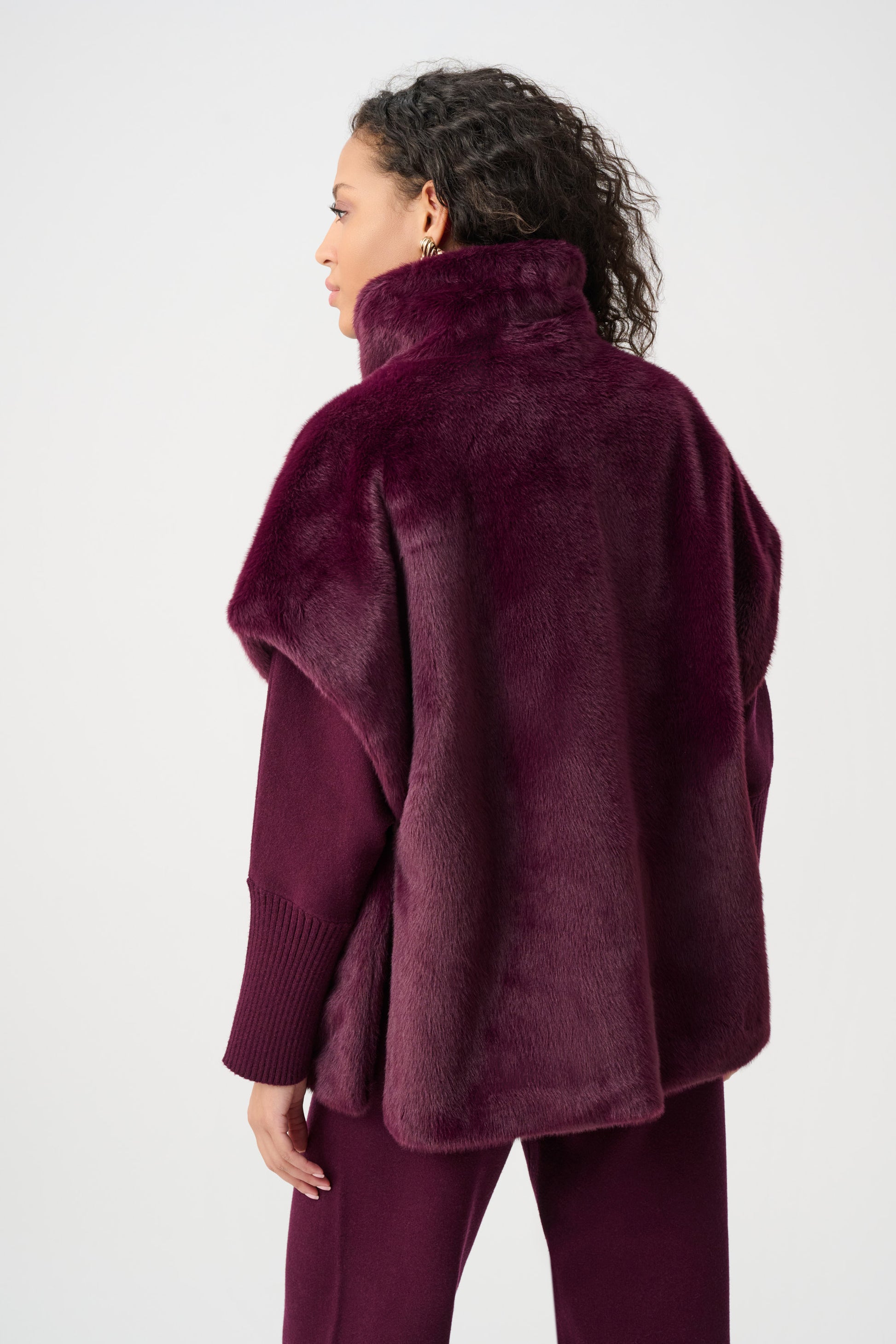 Model wearing burgundy faux fur funnel-neck vest back view Australia