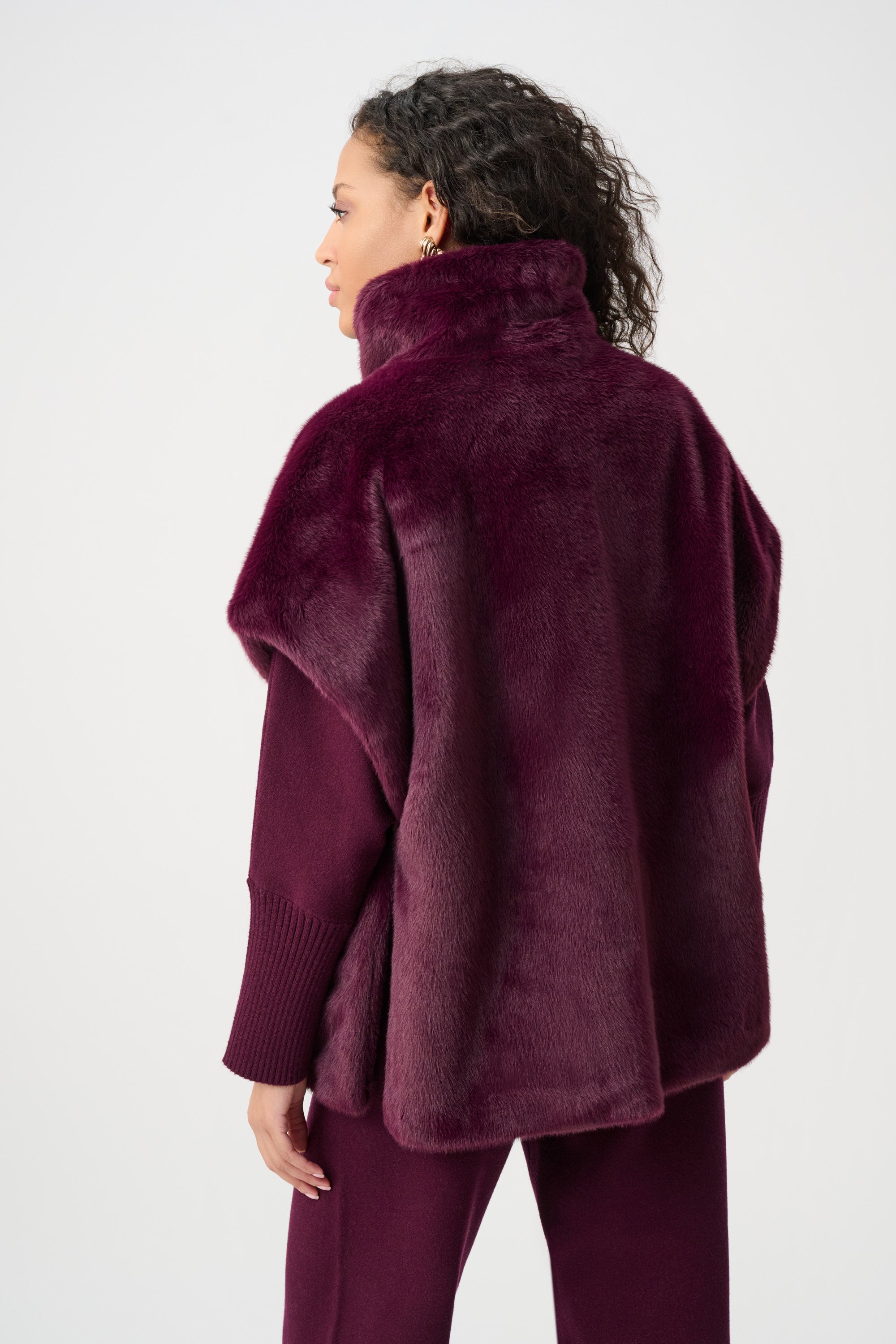 Model wearing burgundy faux fur funnel-neck vest back view Australia