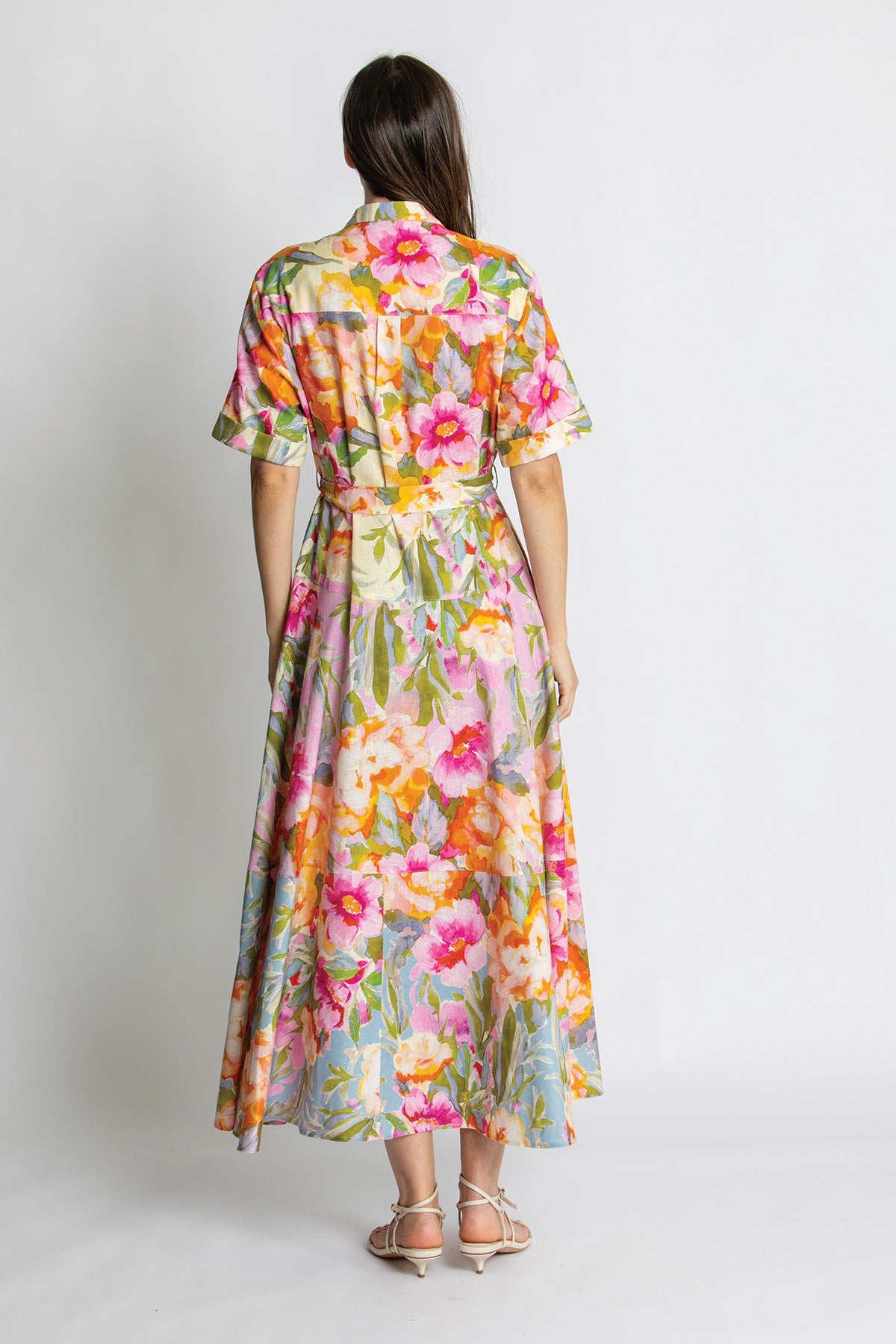 Back view of colourful floral tiered midi dress.