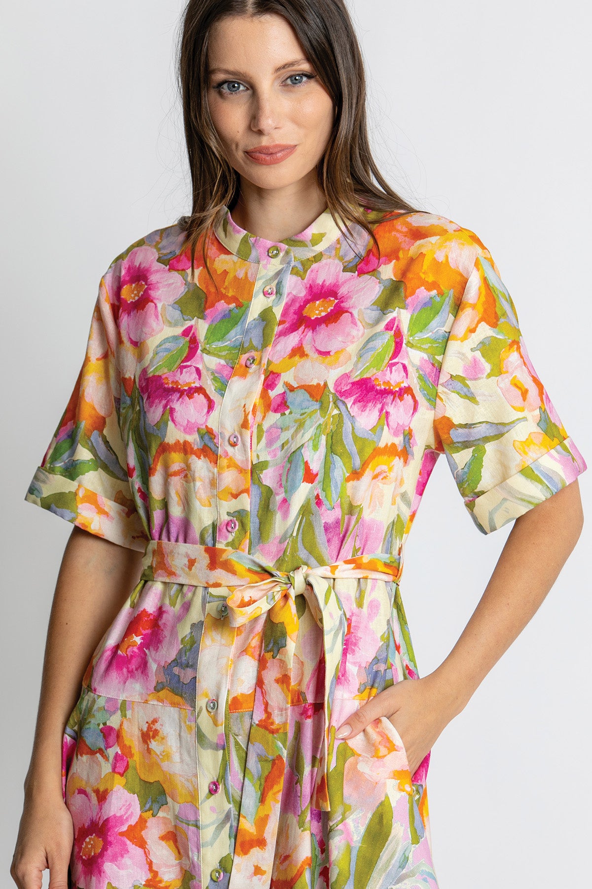 Close-up of floral print and waist tie detail.