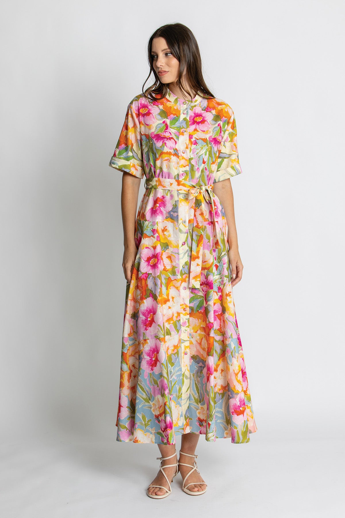 Floral print belted midi dress styled with sandals.