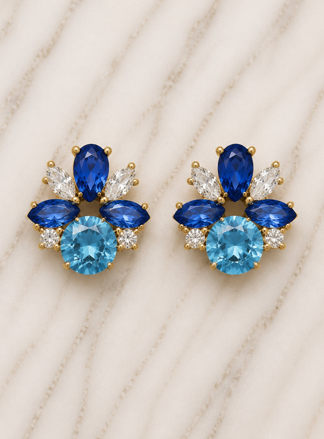 Showies Boutique royal blue floral crystal statement earrings on marble background
