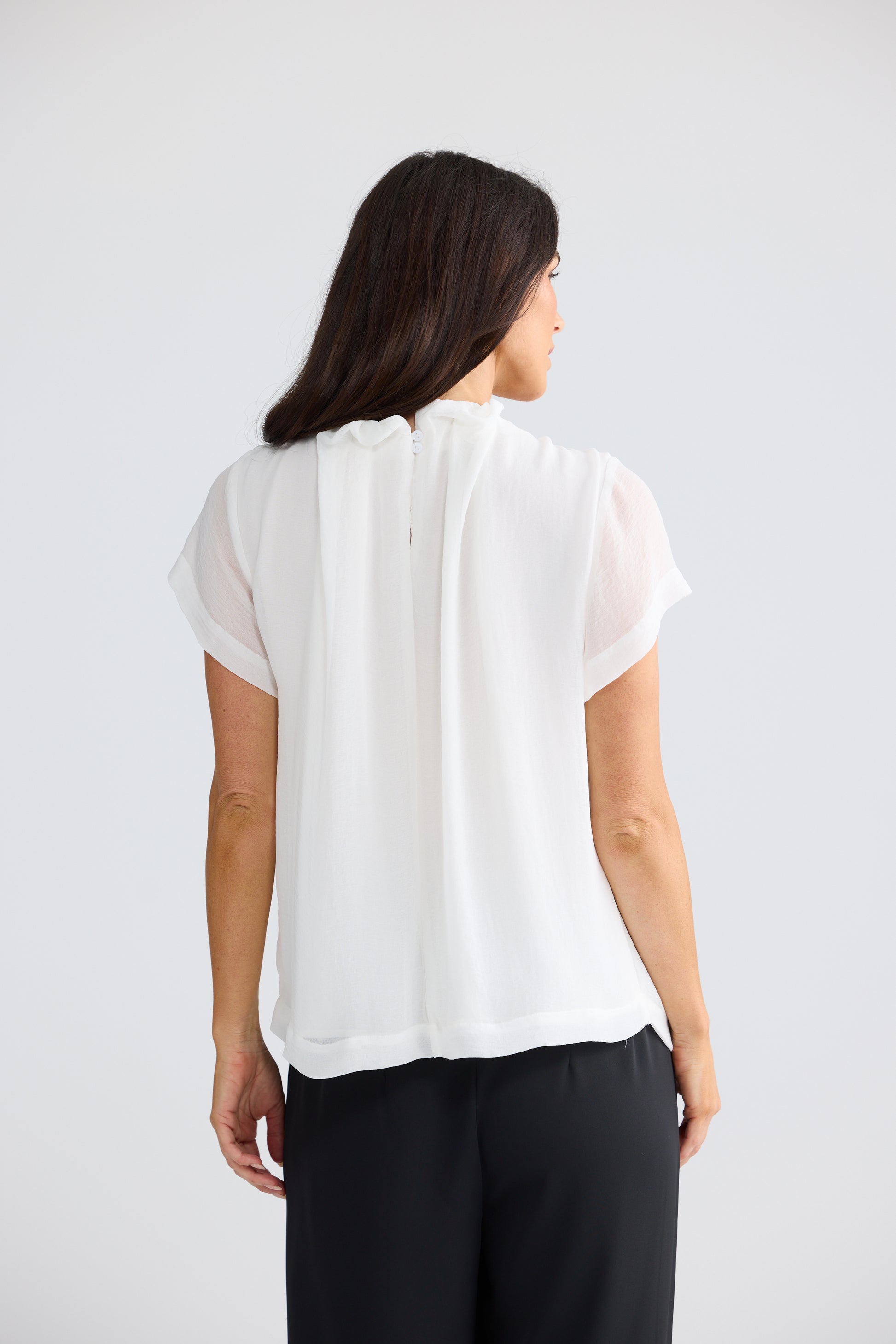 Carina White Ruffle Neck Blouse back view with pleated neckline detail and sheer sleeves