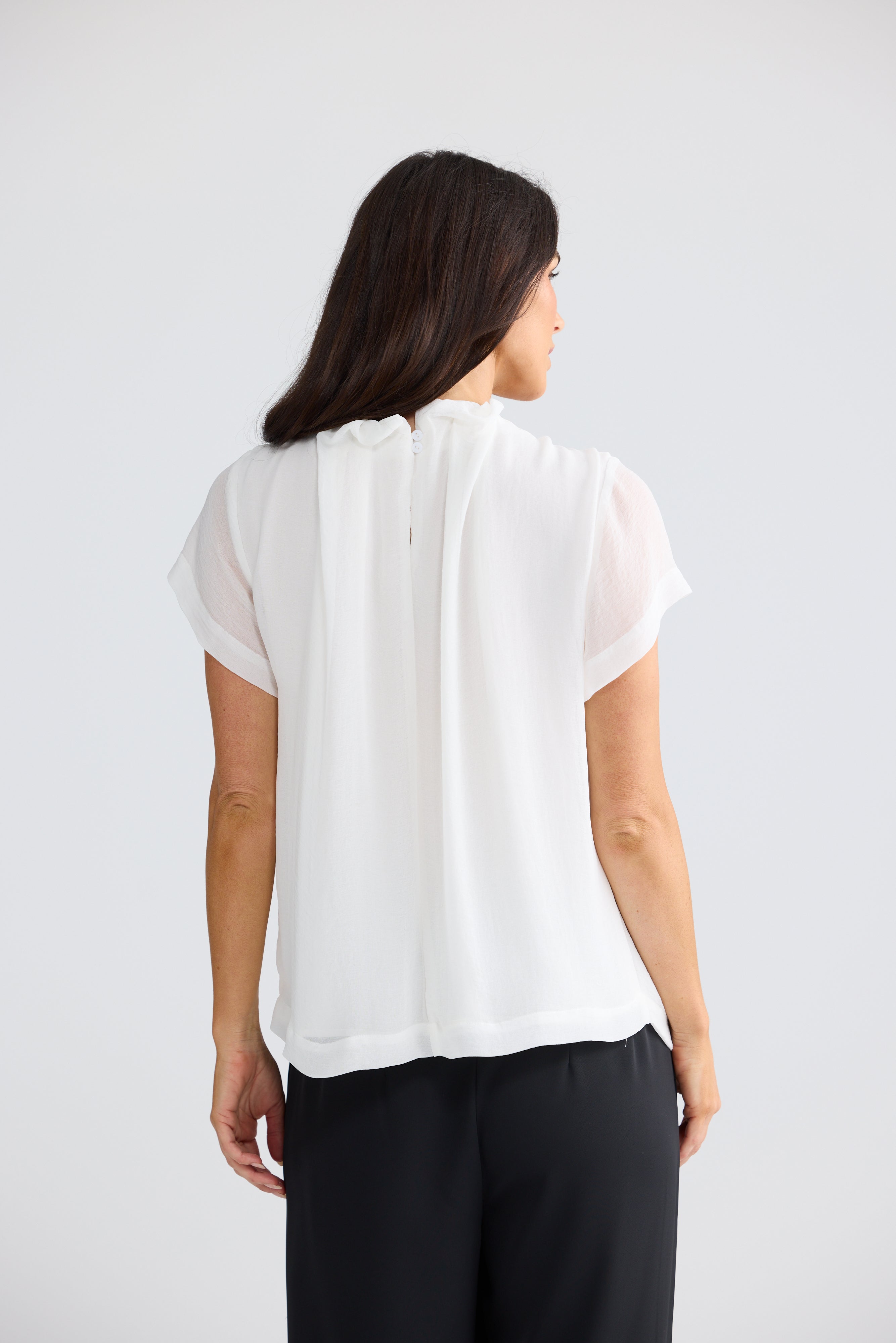 Carina White Ruffle Neck Blouse back view with pleated neckline detail and sheer sleeves