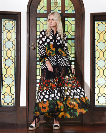 Black floral polka dot tiered maxi dress with colourful prints and statement style.