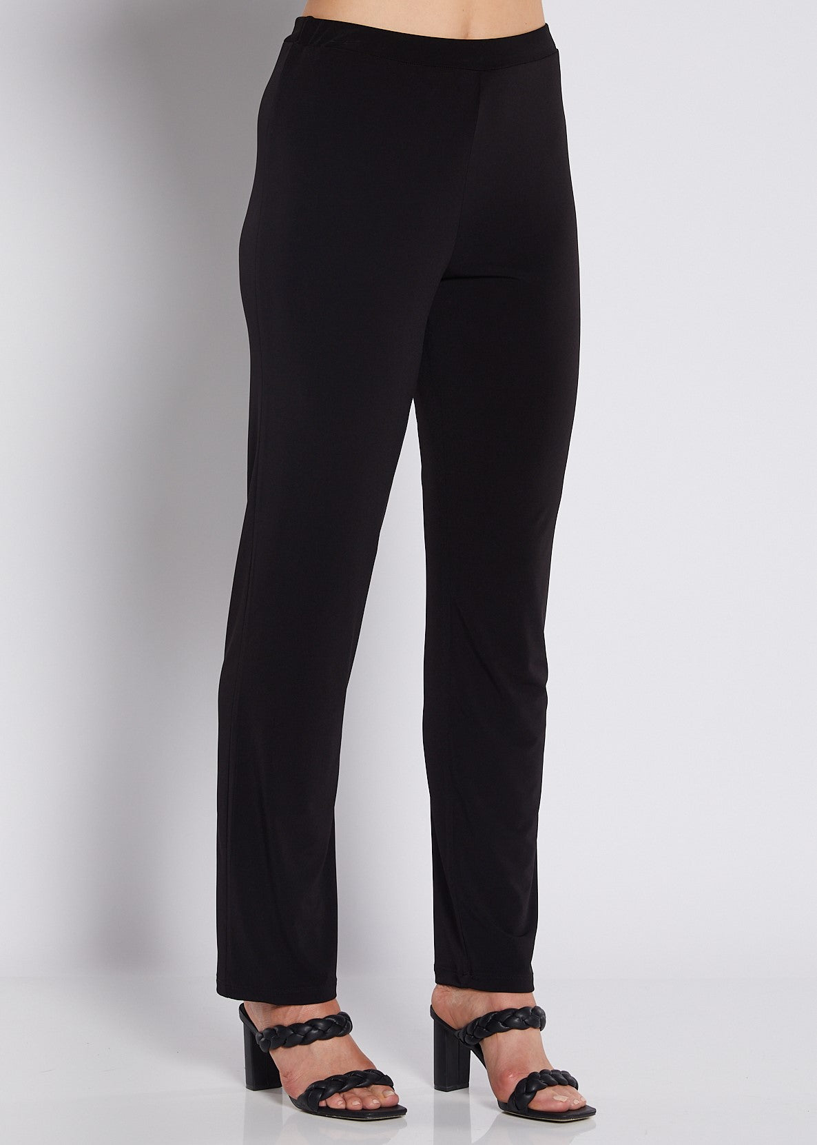Found Linear black slim leg pants with tailored ankle-length silhouette.