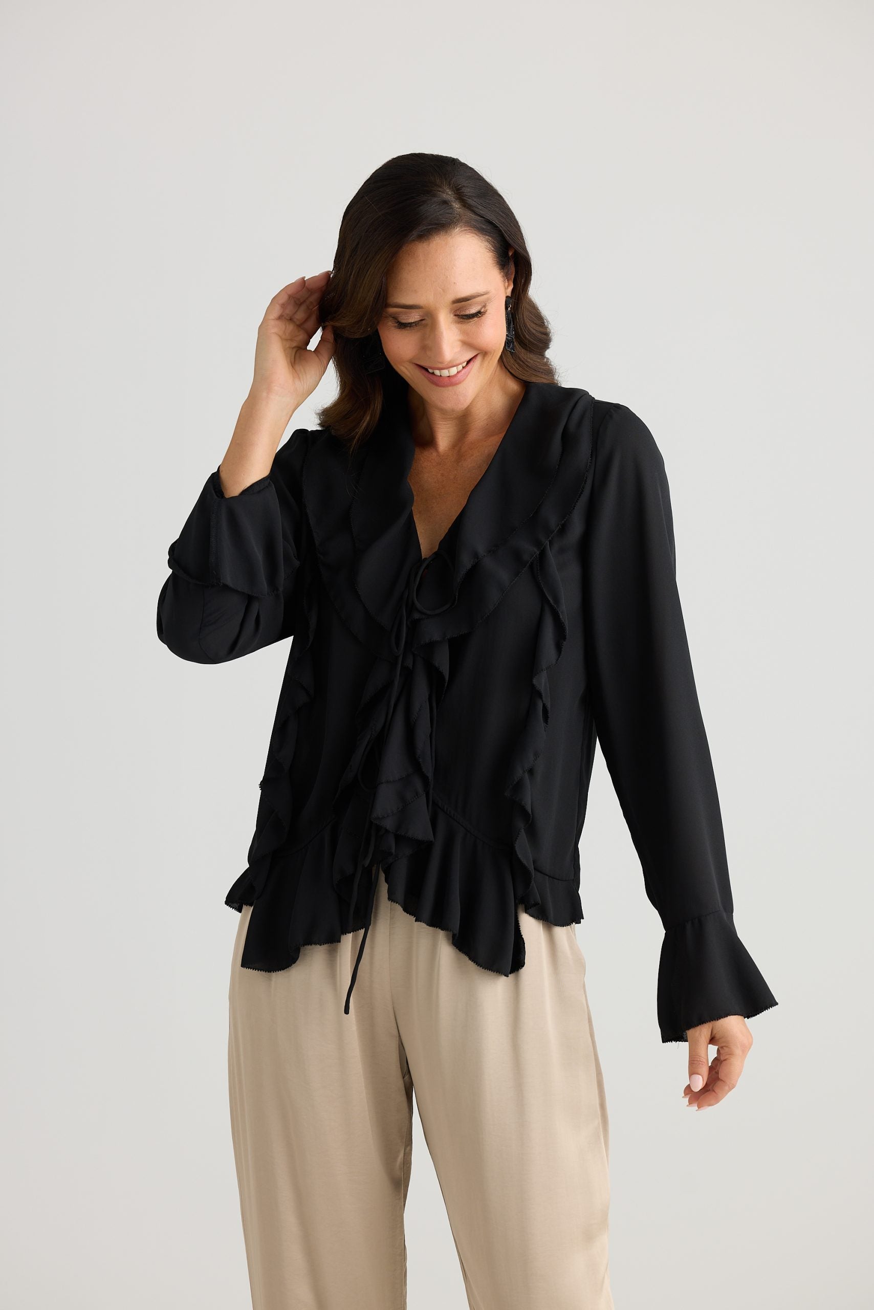 Classic black ruffle blouse style top