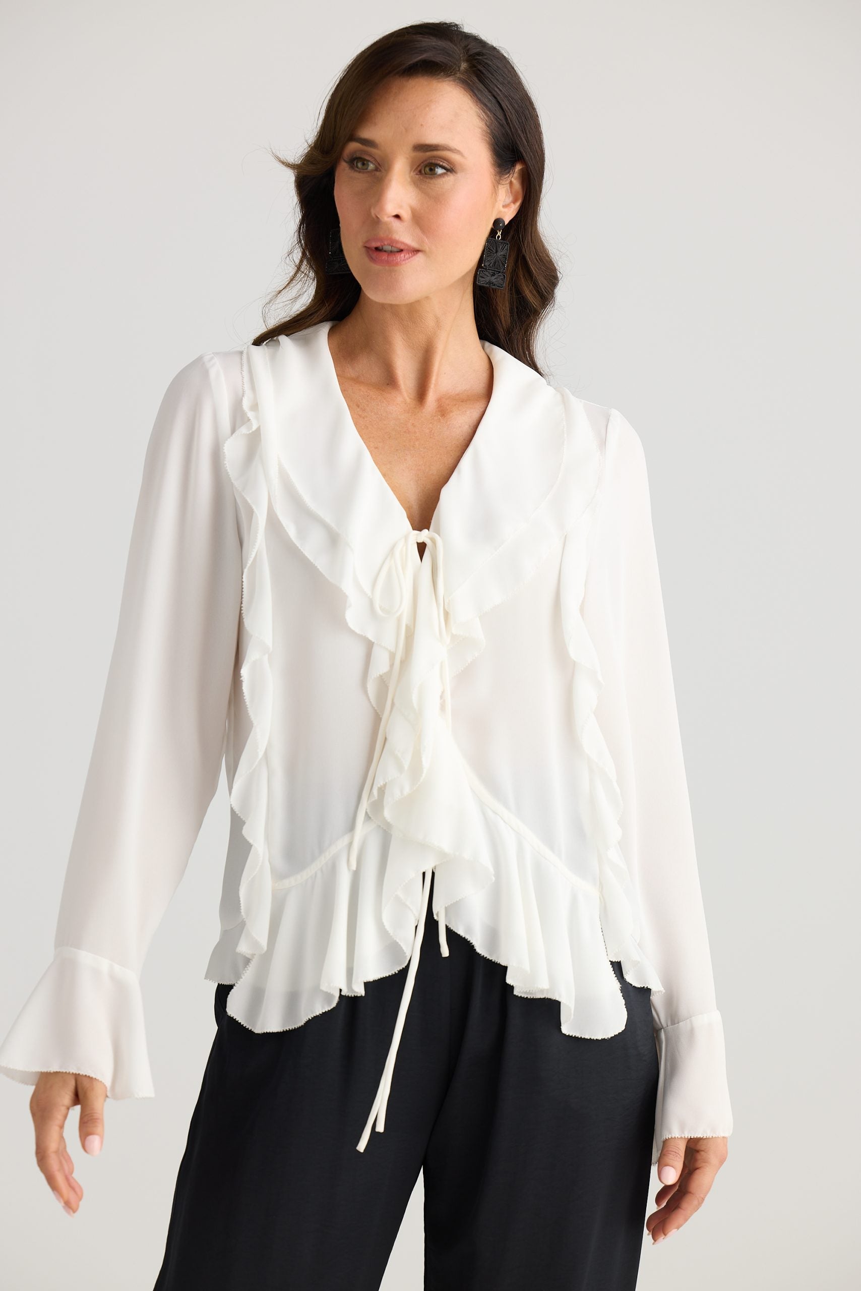 Harper white blouse with ruffle accents