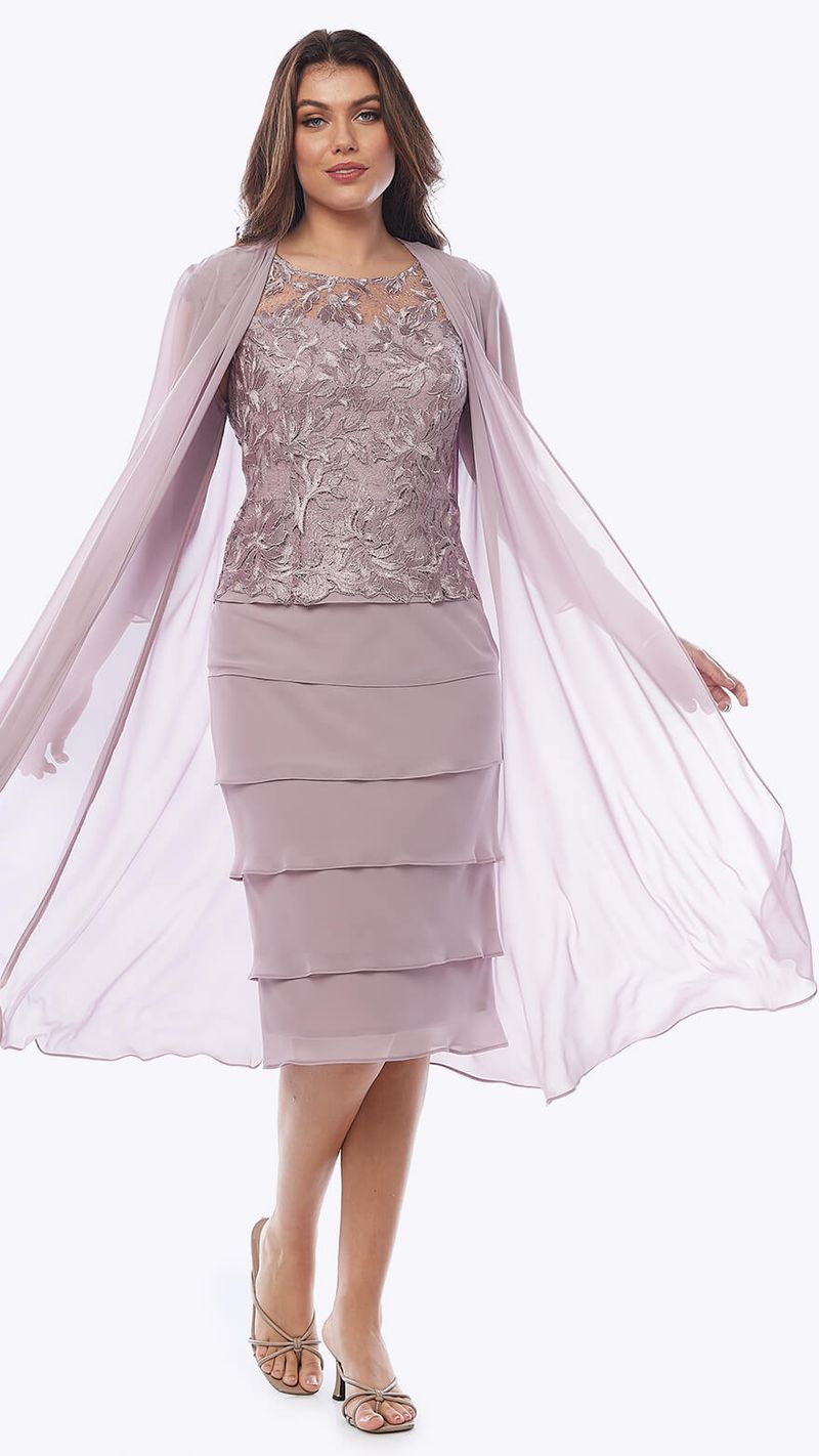 A layered chiffon cocktail dress with a sequin lace bodice. The combination of chiffon and sequin lace adds both elegance and glamour to this ensemble.