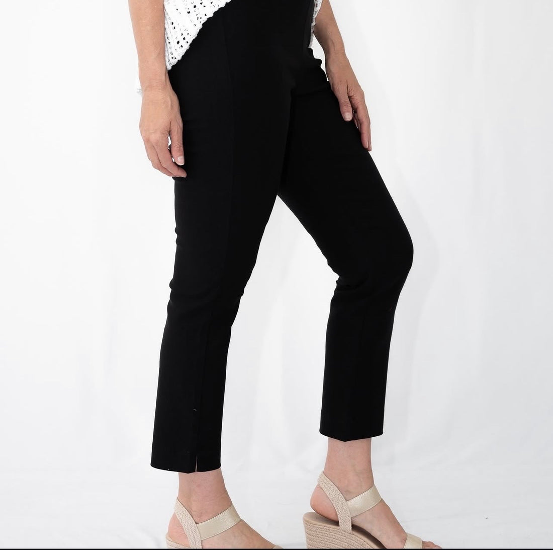 Women’s black cropped straight-leg pants with sandals