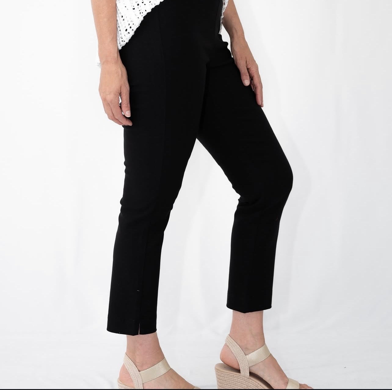 Side view of black ankle-length slim fit pants
