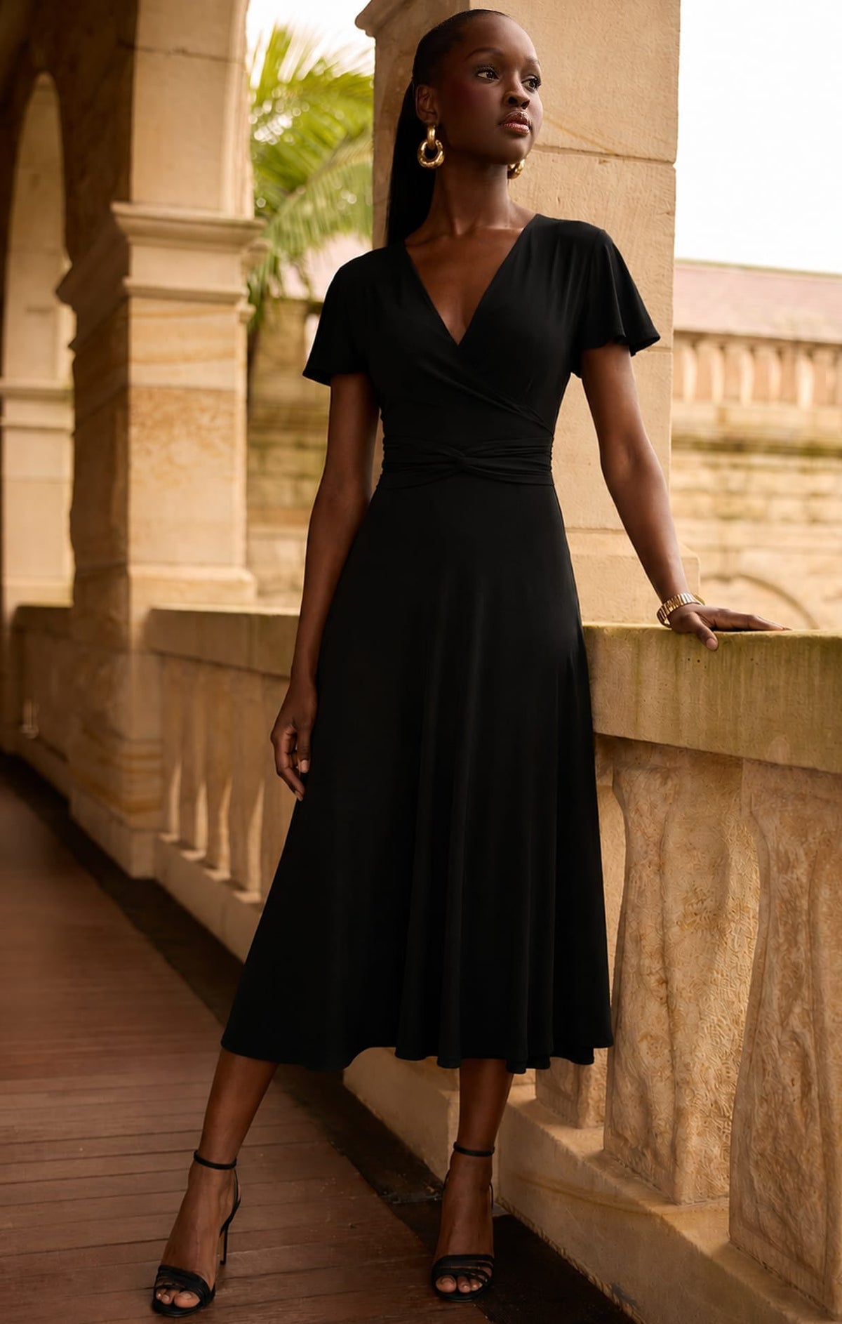 Flute Sleeve Reverse Wrap In Black by Sacha Drake