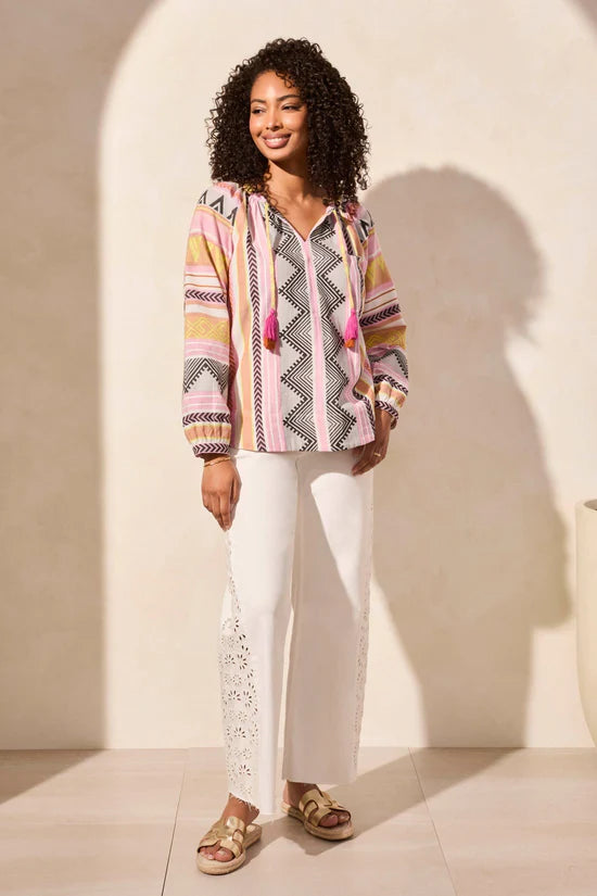 Channel boho vibes in this cotton easygoing blouse with geometric print and tassel-tipped ties that hang from a notched neckline.