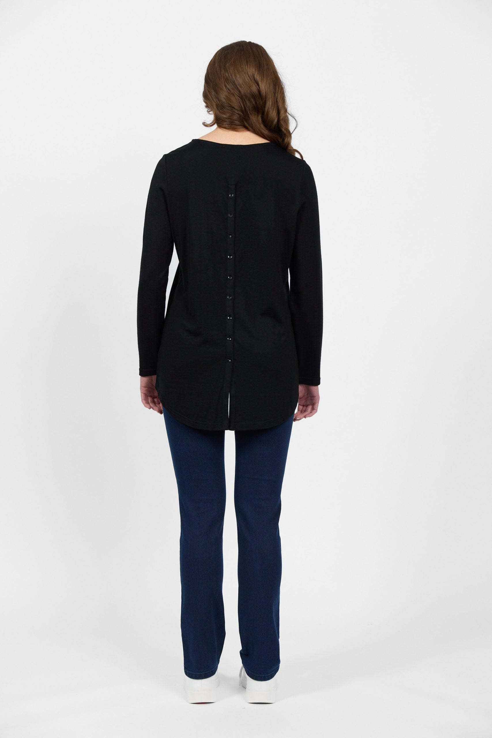 Back view of black merino top with button placket detail