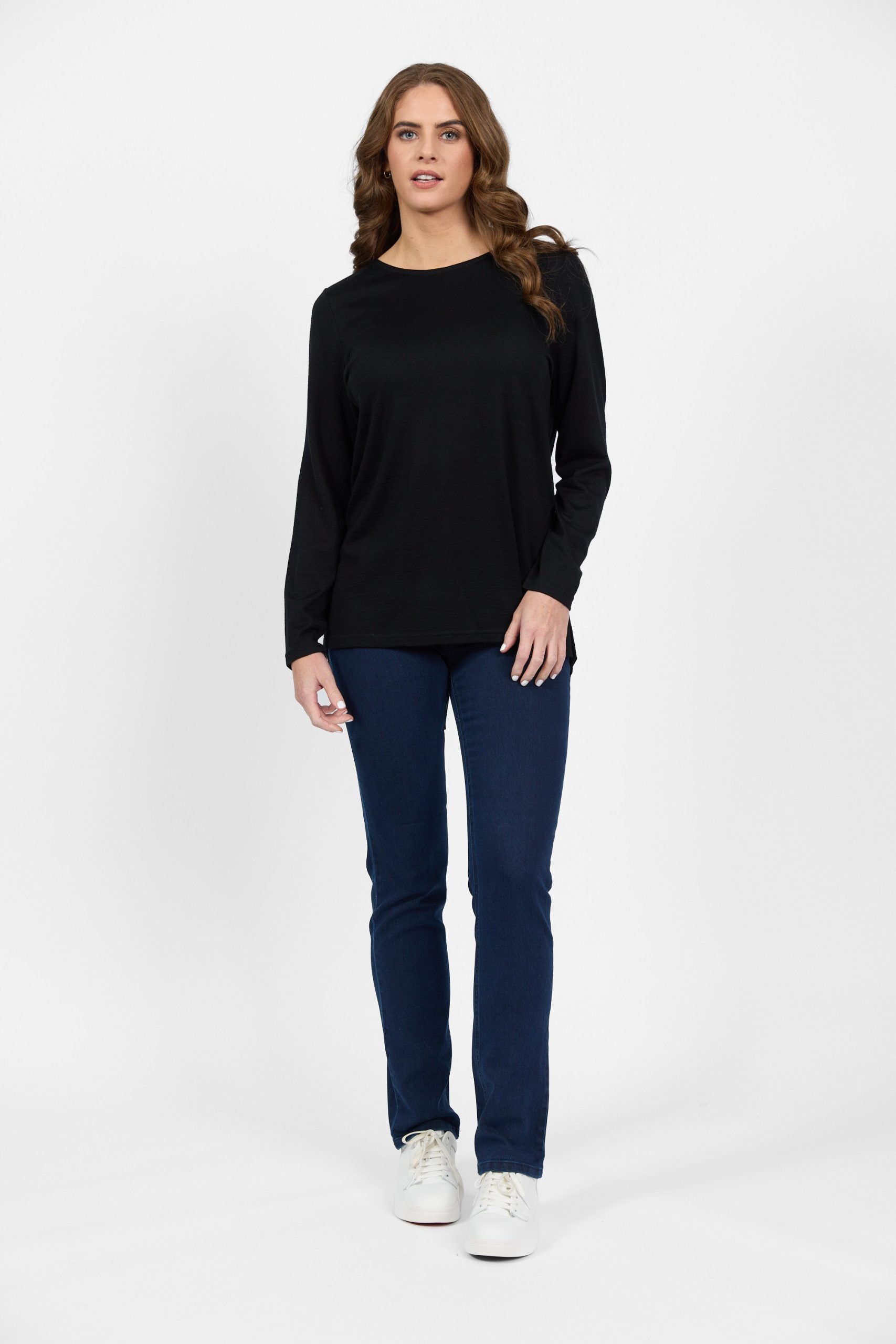Black merino long sleeve top with slim fit blue jeans