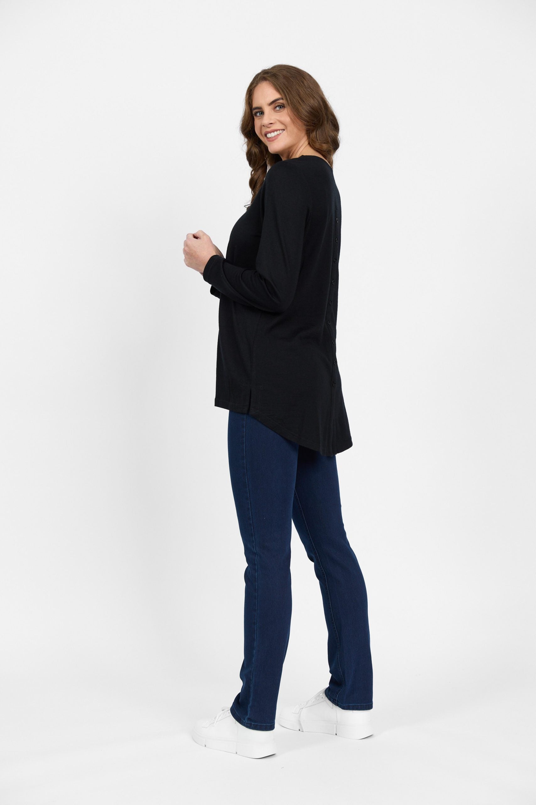 Side view of black merino long sleeve knit top
