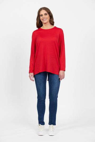 Women’s scarlet merino long sleeve top with blue jeans