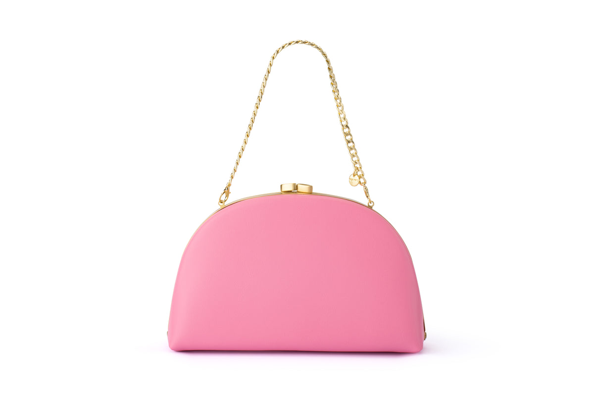Pink clutch bag with gold-tone frame and chain handle.