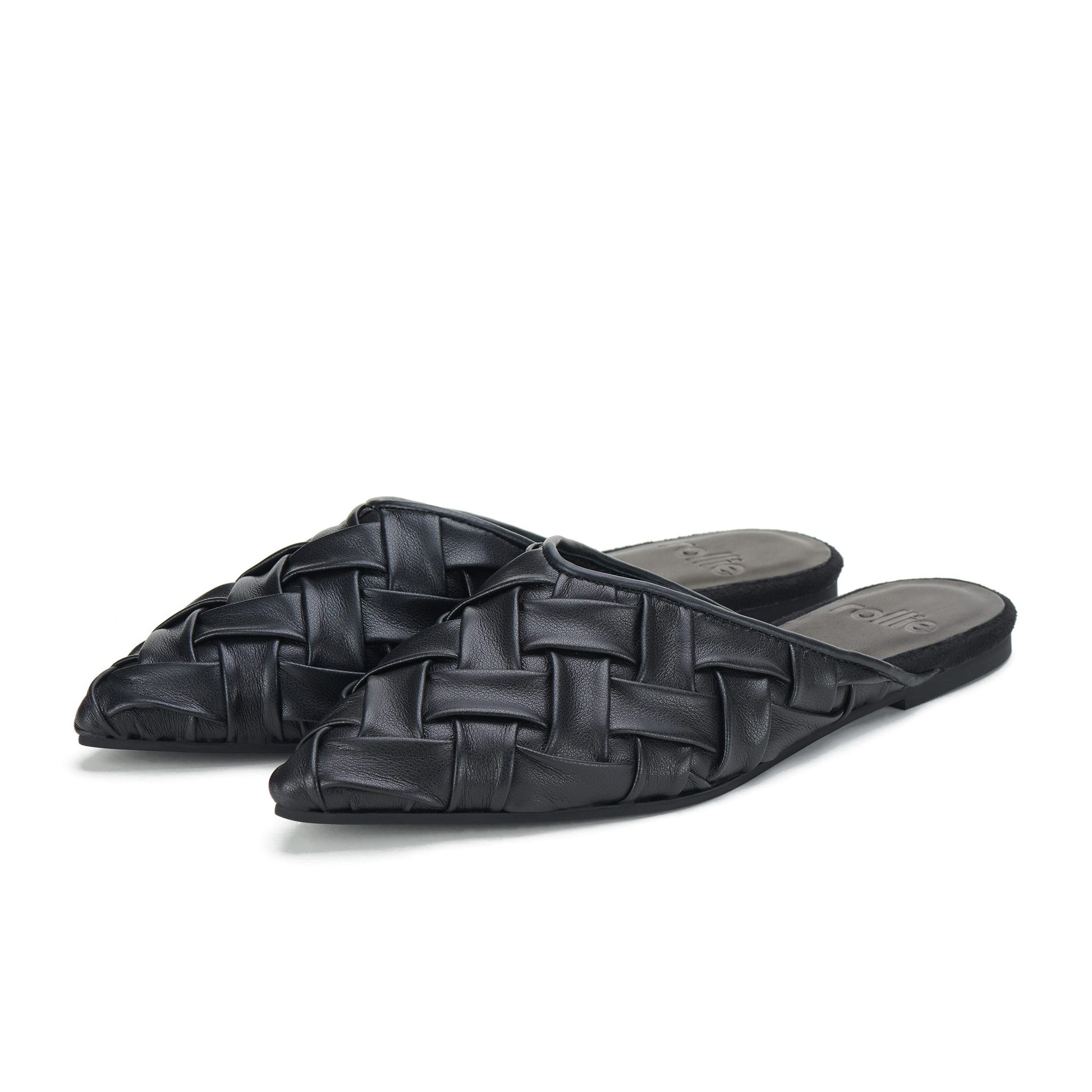 Pair of black woven pointed mule sandals on white background