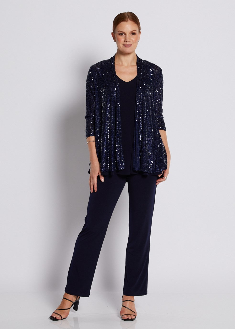 Navy sequin swing jacket with three-quarter sleeves styled for elegant evening wear.