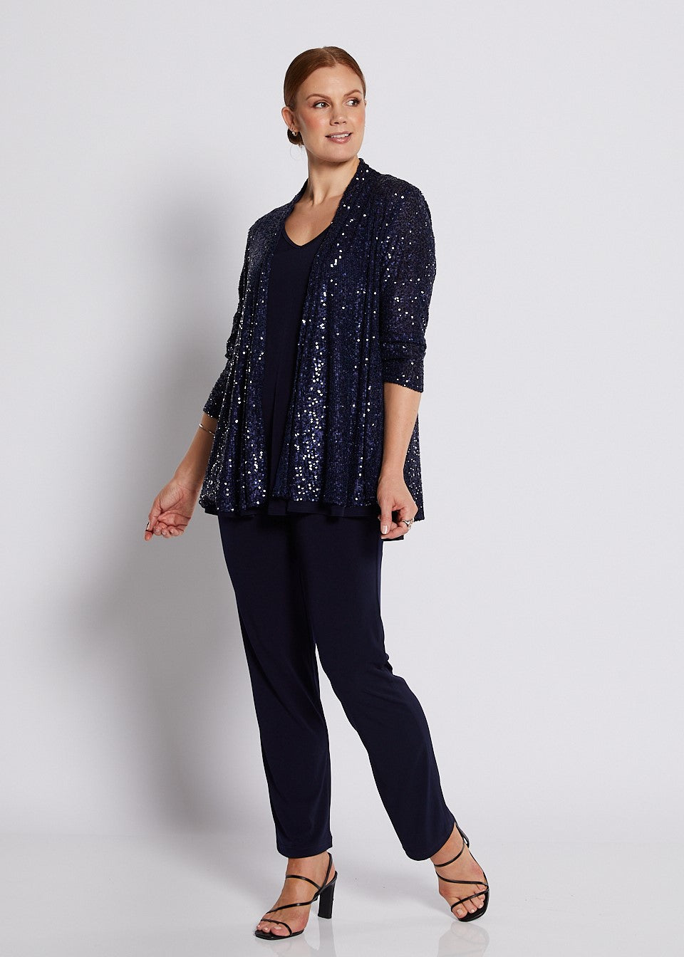 Navy sequin swing jacket with three-quarter sleeves styled for elegant evening wear.
