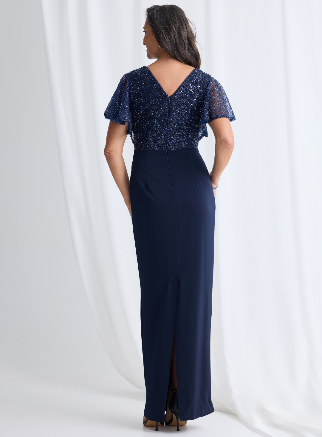 Women’s navy formal gown with bead detailing