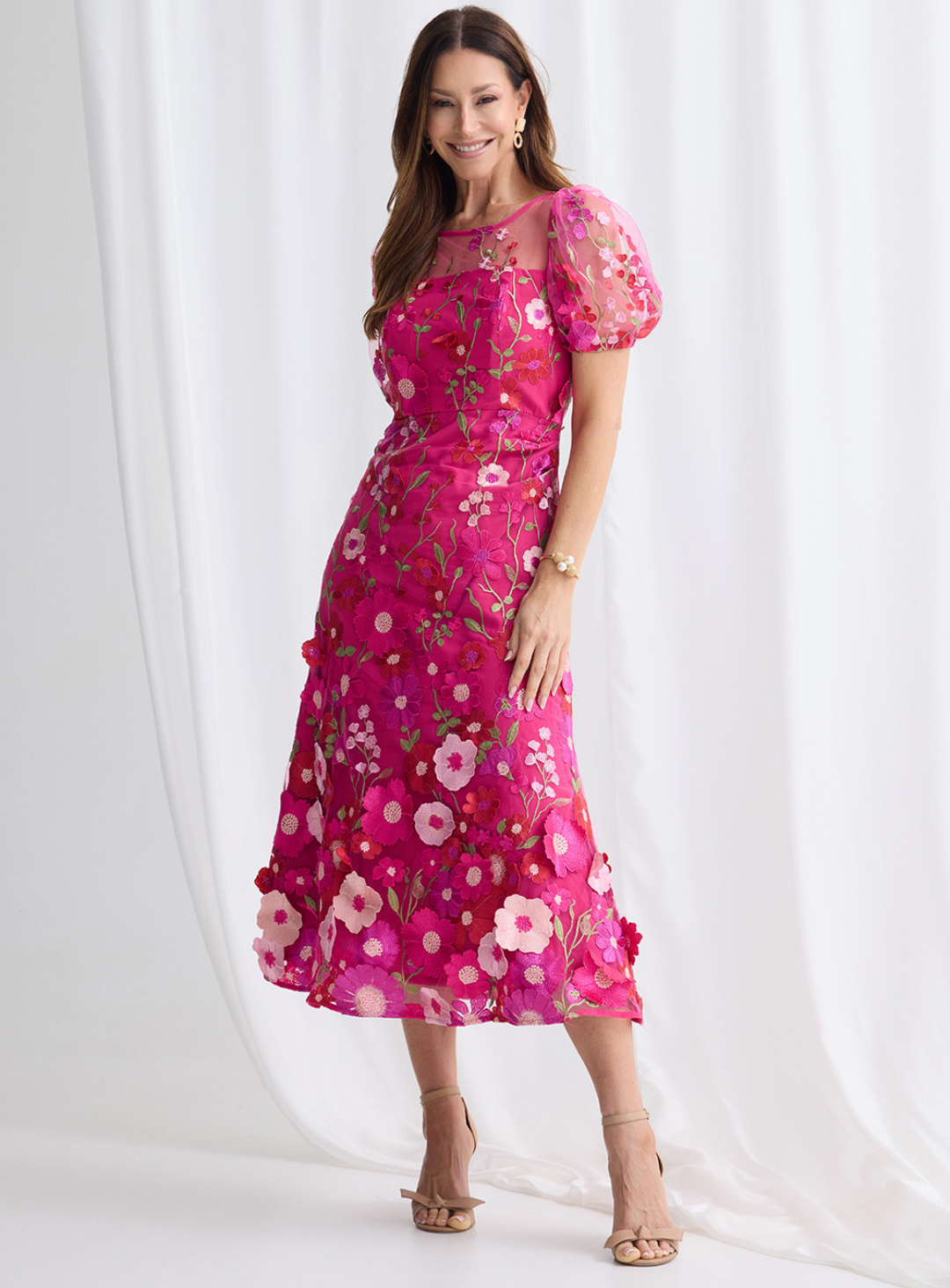 Fuchsia floral midi dress with 3D flower appliqué and puff sleeves.
