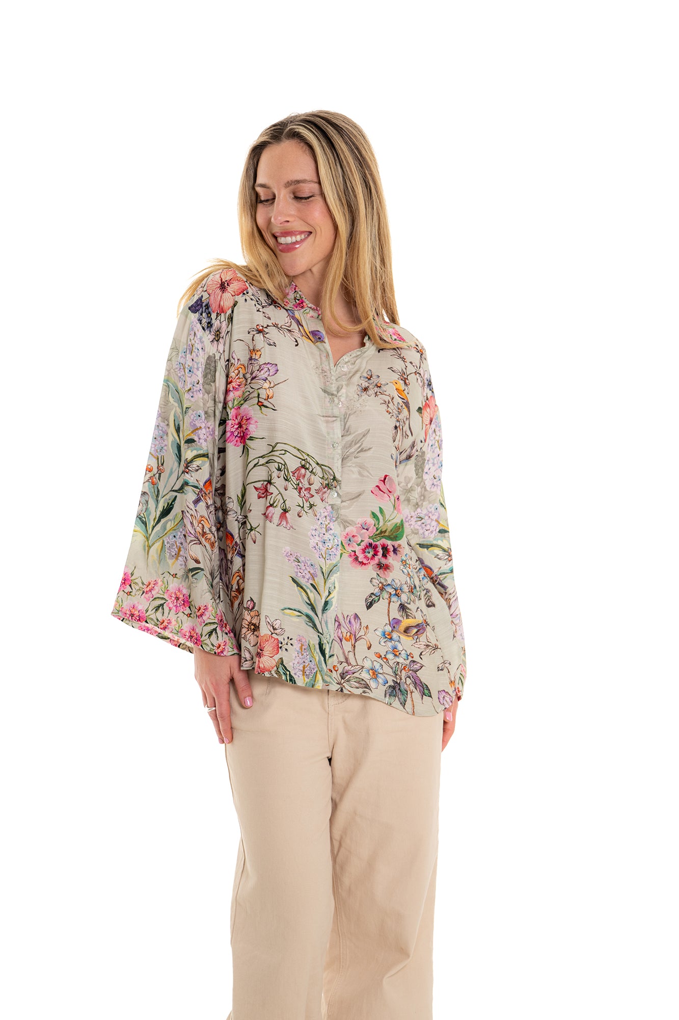 Elegant beige floral long sleeve blouse with multicolor botanical design.