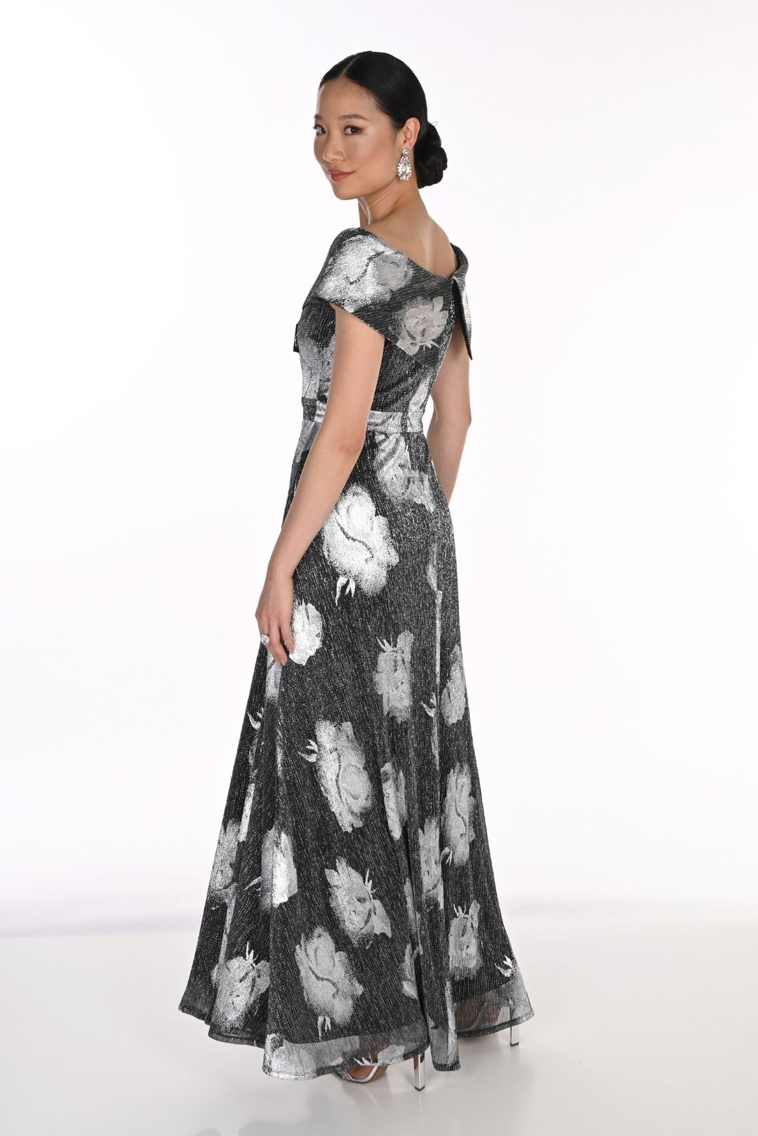 Black and white floral floor-length gown with elegant V-neckline and cap sleeves.