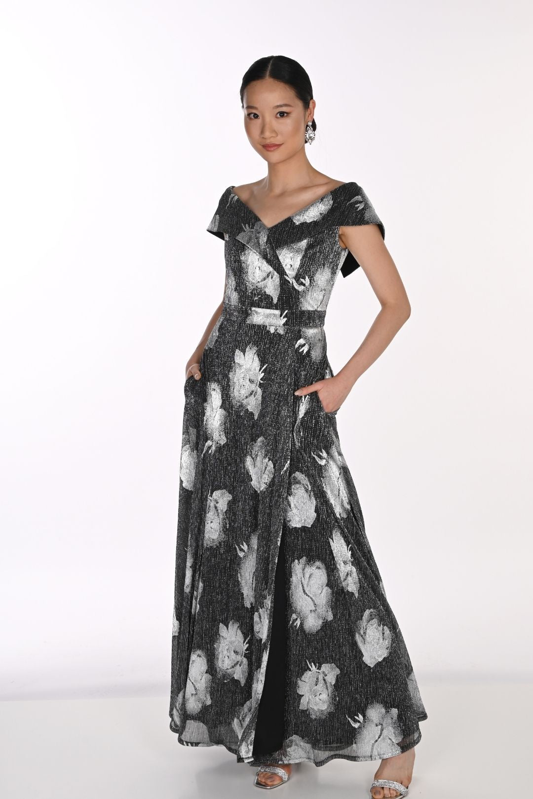 Black floral maxi gown with flowing silhouette and statement flower print.