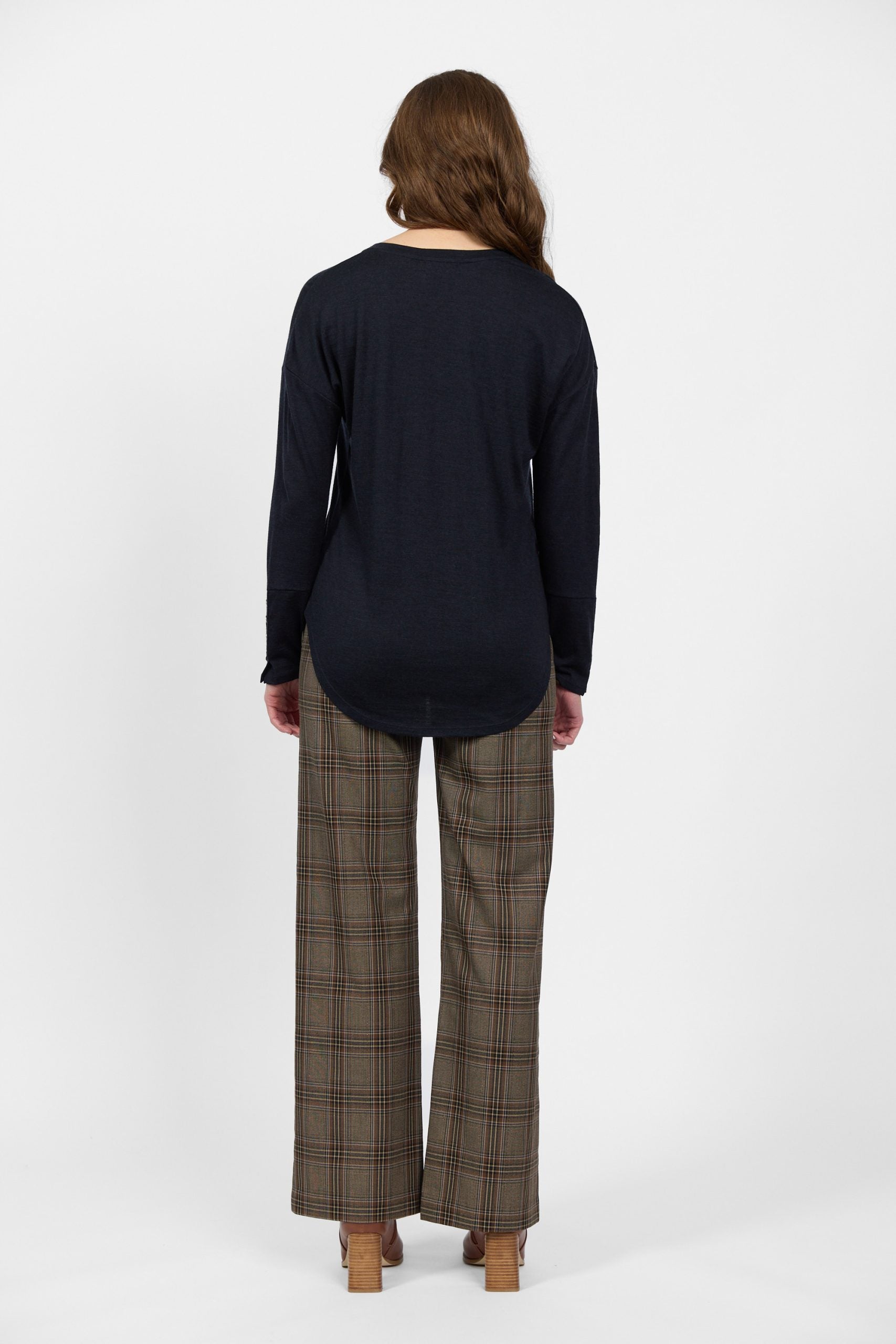 Back view of midnight merino long sleeve women’s top