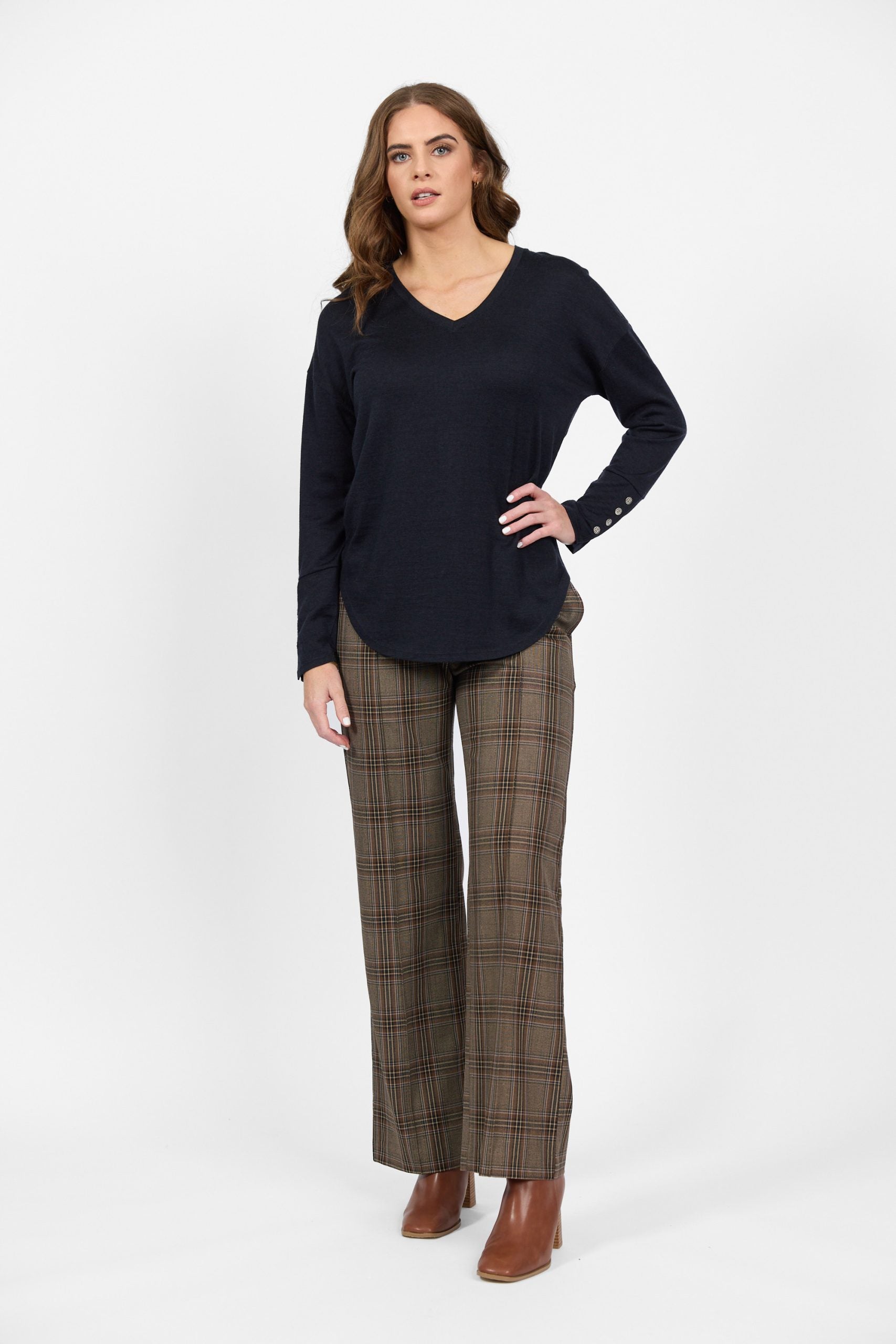 Navy merino knit top with button cuff detail and check pants