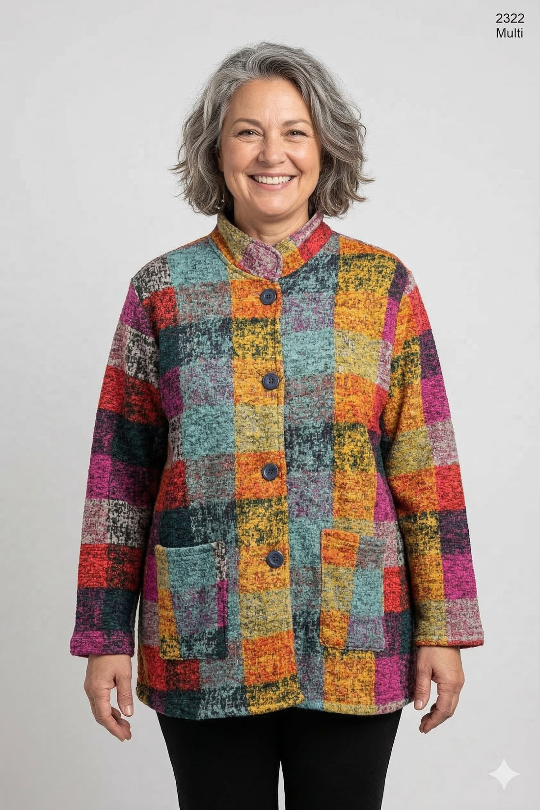 Woman wearing a multicolor patchwork cotton jacket with button front and pockets on a white background