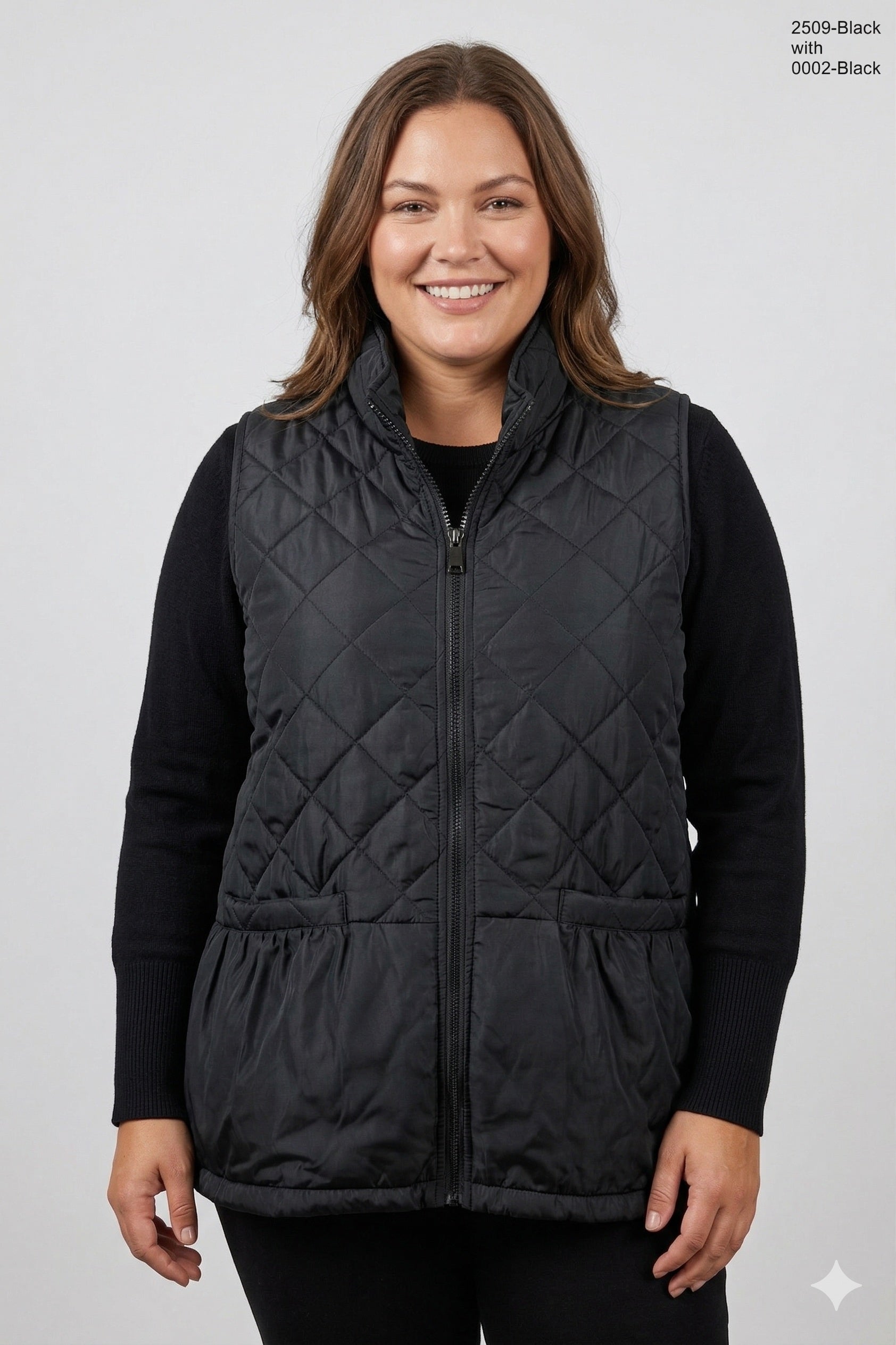 Woman wearing a black quilted puffer vest with zip front and pockets on a white background