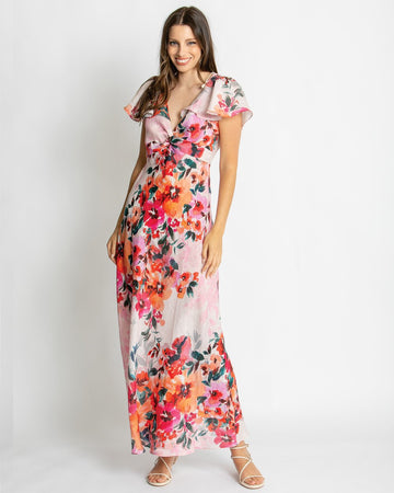 Pink floral maxi dress featuring a vibrant botanical print, flattering sweetheart neckline, flutter sleeves, and flowing silhouette for elegant summer occasion wear.