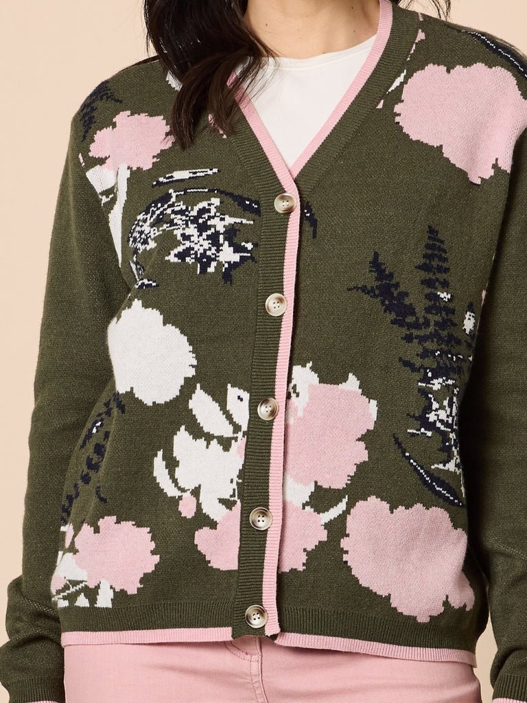 Women’s khaki floral knit cardigan with pink trim and button front, featuring soft pink and white floral pattern, styled casually for everyday wear at Showies Boutique Adelaide