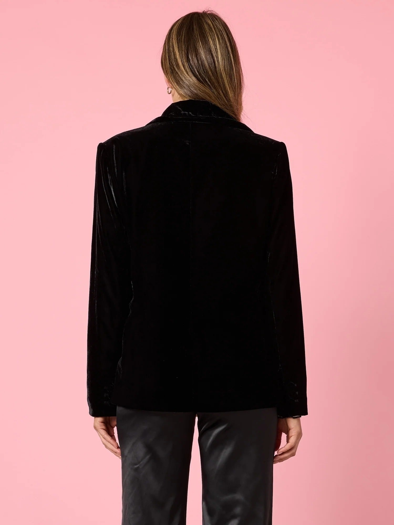 Back view of black velvet tailored blazer showing structured fit and smooth finish, styled with black pants, from Showies Boutique Adelaide